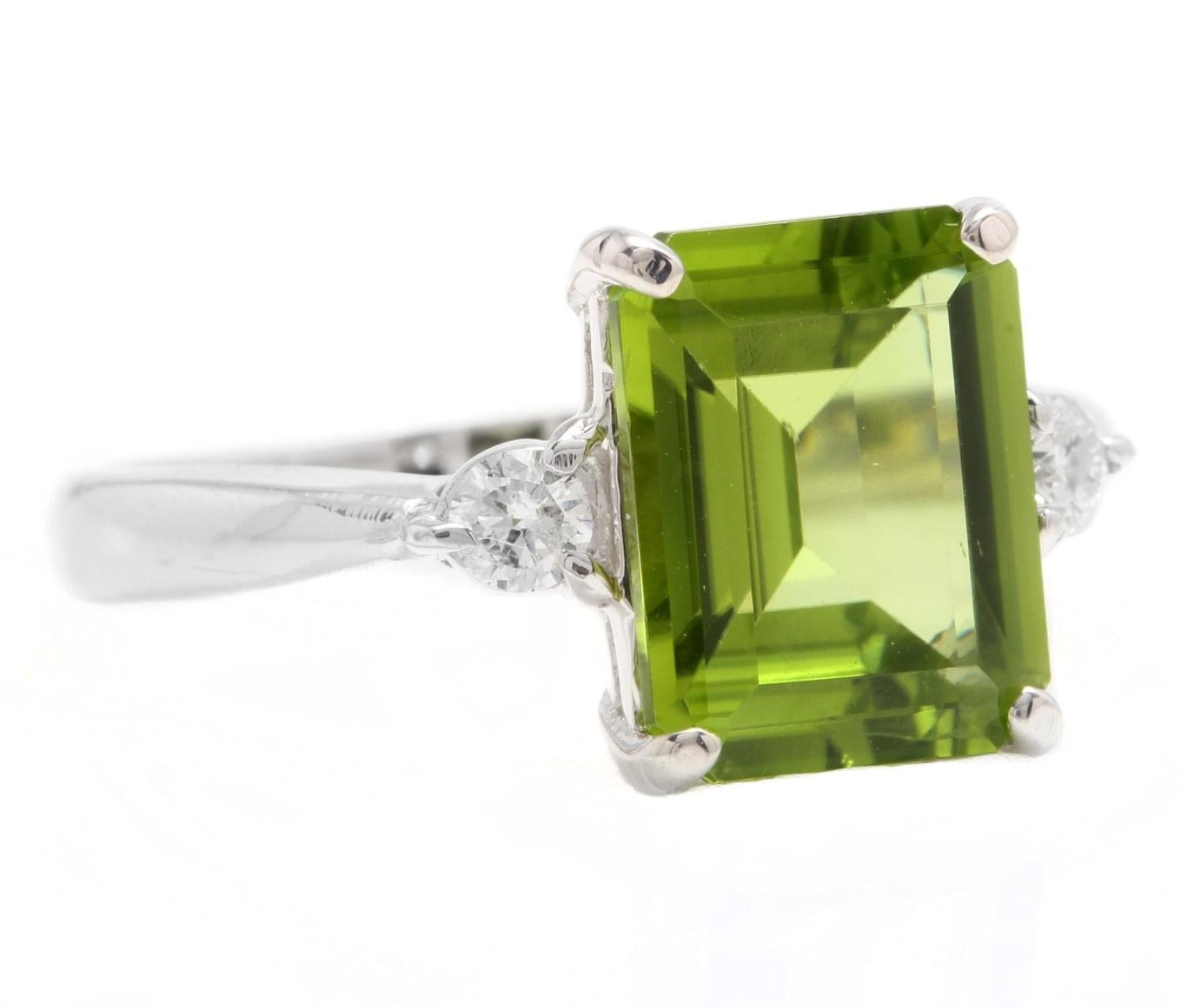 3.18 Carats Natural Very Nice Looking Peridot and Diamond 14K Solid White Gold Ring

Stamped: 14K

Suggested Replacement Value: Approx. $3,500.00

Total Natural Emerald Cut Peridot Weight is: Approx. 3.00 Carats 

Peridot Measures: Approx. 10 x