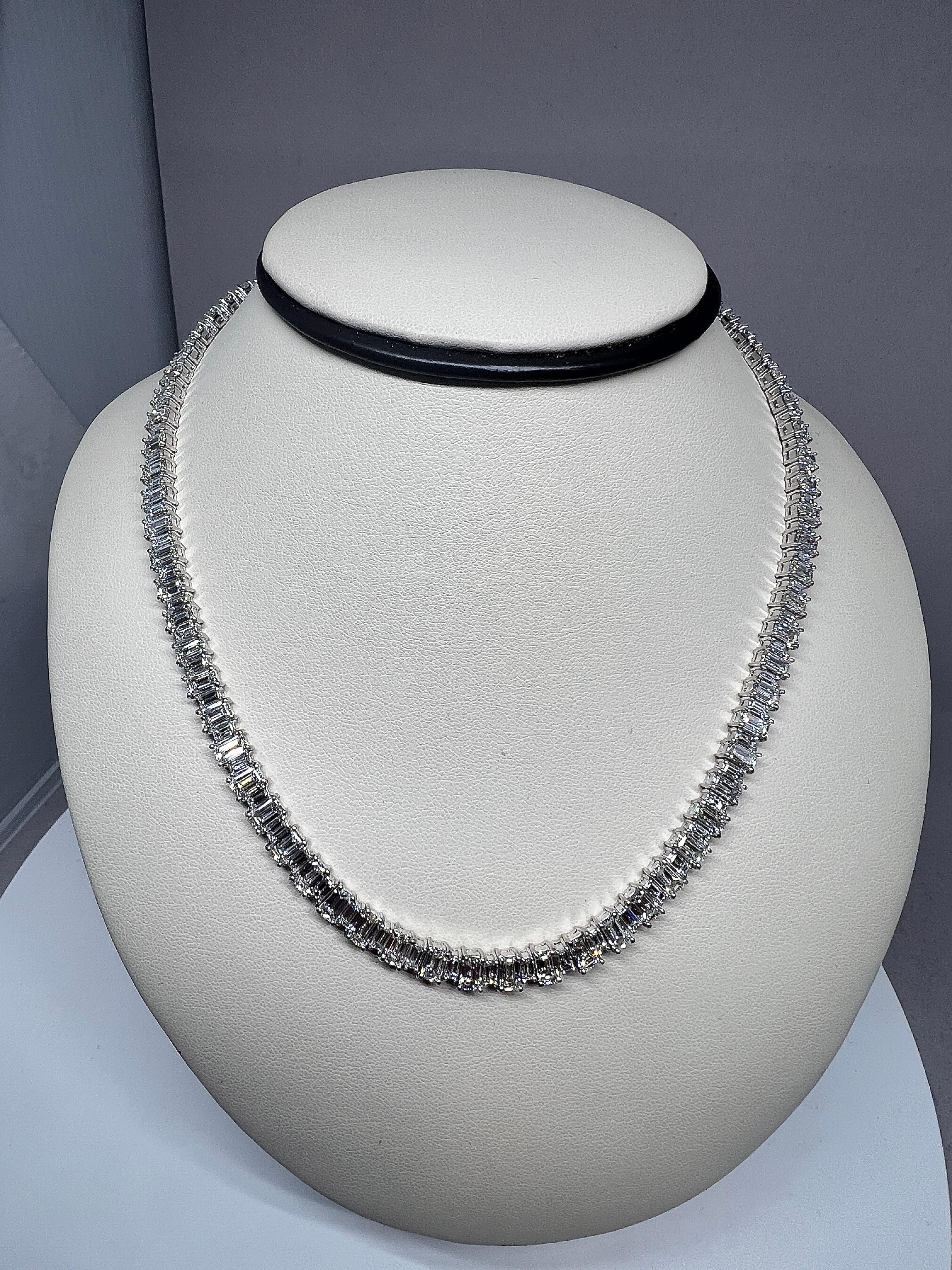 Stunning handmade emerald cut & baguette cut diamond necklace. The necklace features 31.84 cts of diamonds graded G-H in color and VS1-VS2 in clarity set in platinum. The necklace is 16 inches in length and can be extended for a fee.

