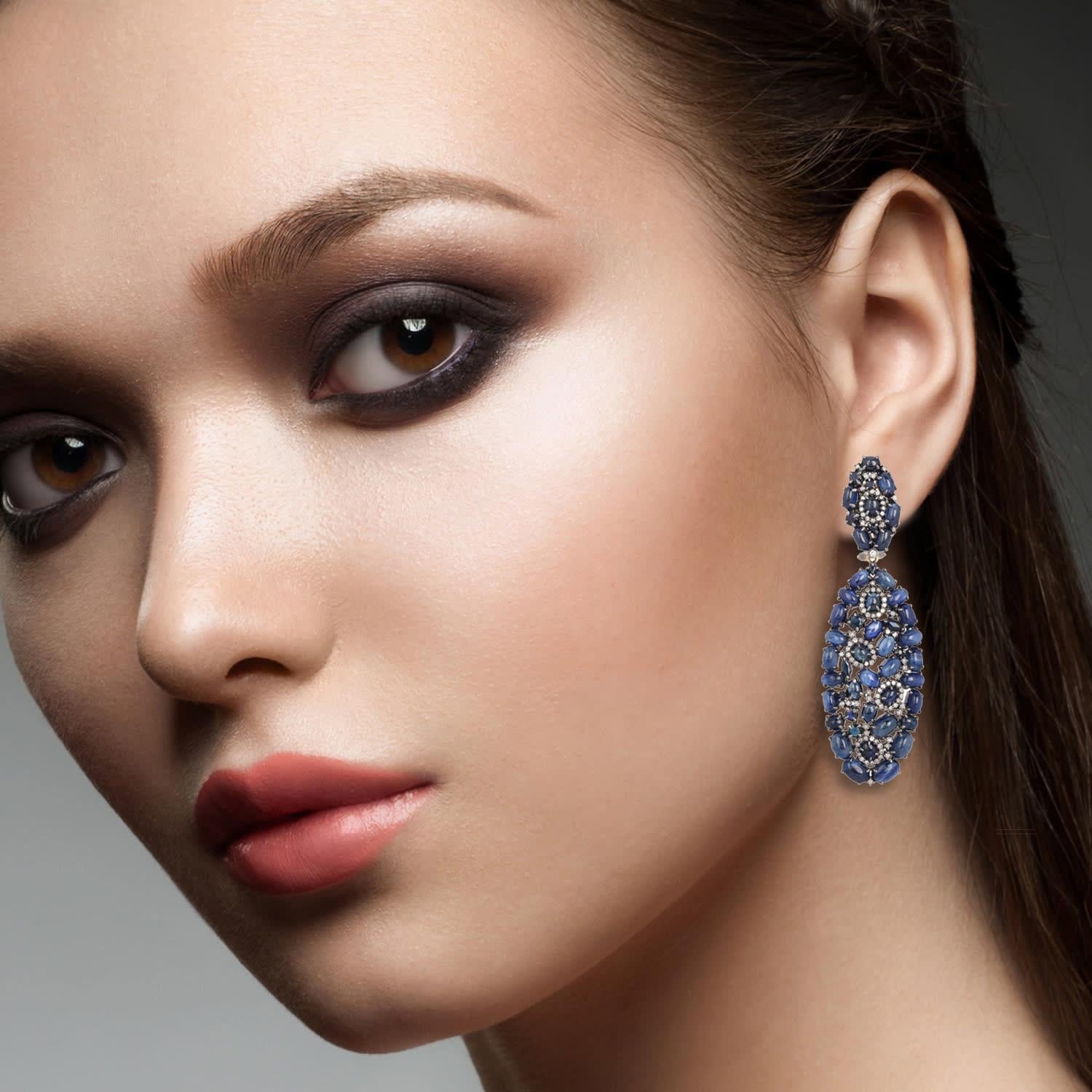 Cast from 18 karat gold & sterling silver, these beautiful earrings are hand set with 31.86 carats blue sapphire and .96 carats of shimmering diamonds.

FOLLOW  MEGHNA JEWELS storefront to view the latest collection & exclusive pieces.  Meghna