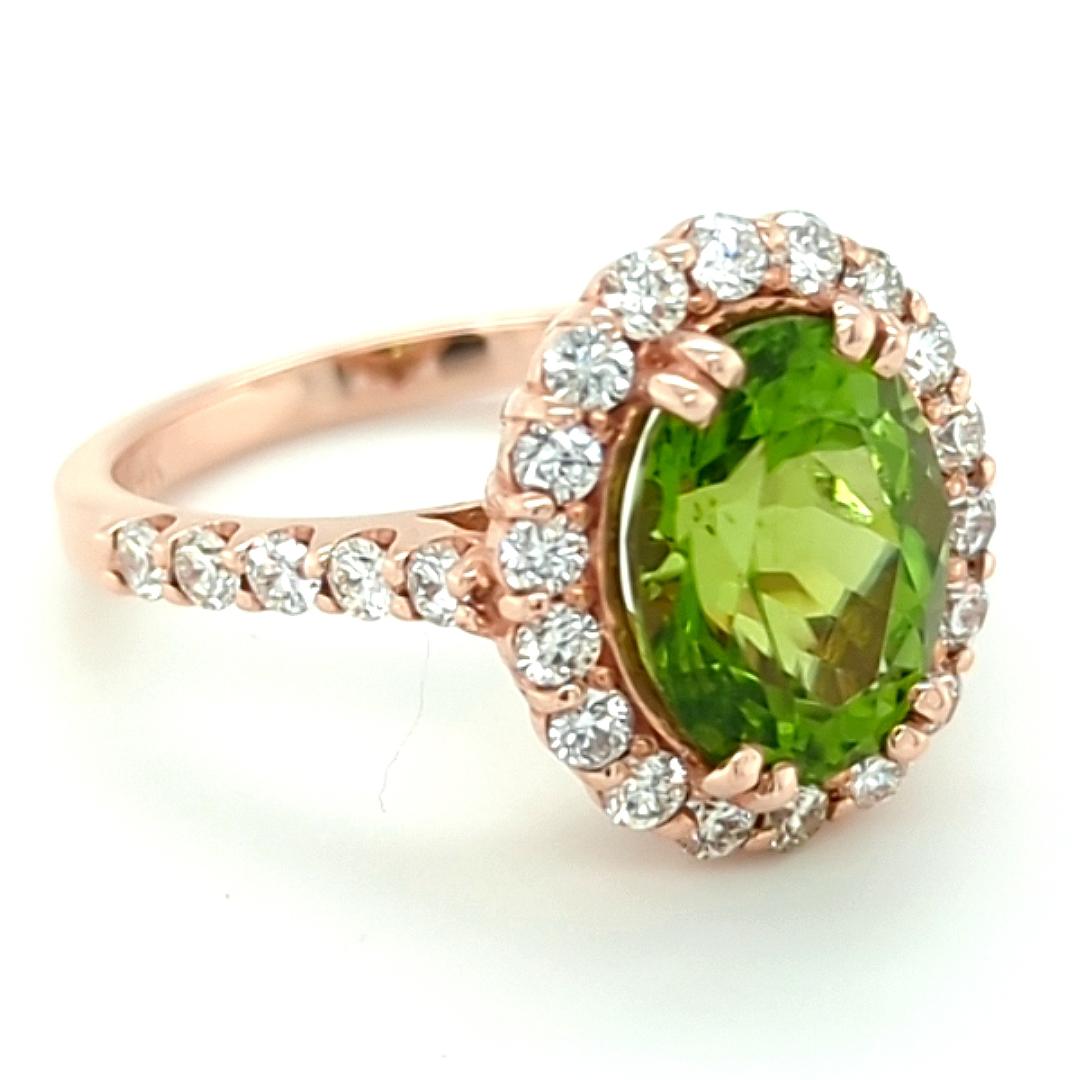Oval Cut 3.18ct Arizona Peridot set in 14kt Halo Ring with 0.83ct of Diamonds For Sale
