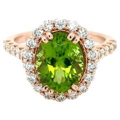 3.18ct Arizona Peridot set in 14kt Halo Ring with 0.83ct of Diamonds