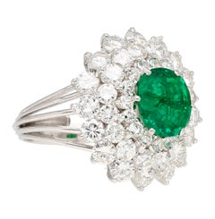 3.19 Carat Oval Cut Emerald Minor Oil & Diamond Cluster Platinum Vintage Ring