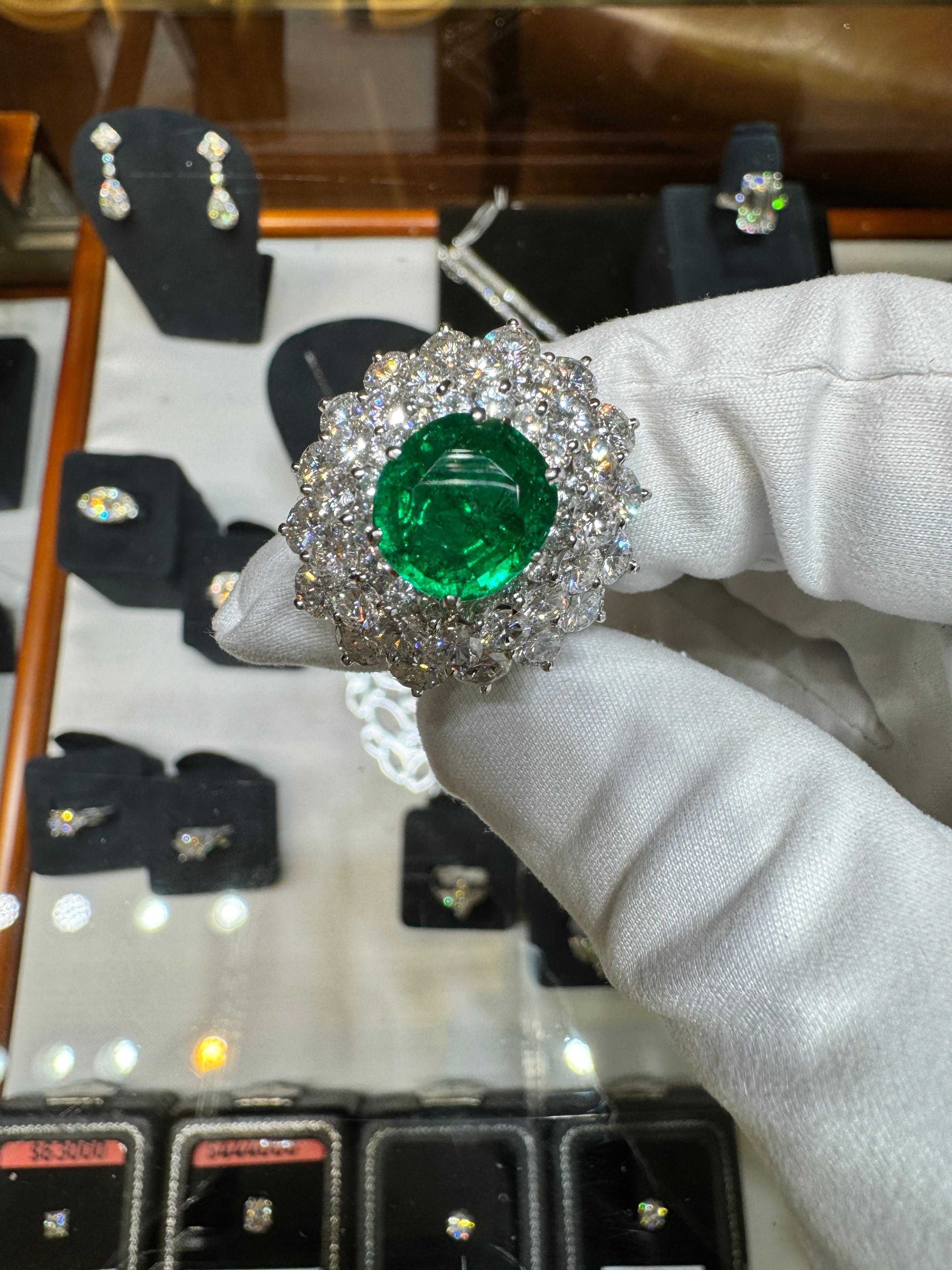 Women's 3.19 Carat Oval Cut Emerald Minor Oil & Diamond Cluster Platinum Vintage Ring For Sale