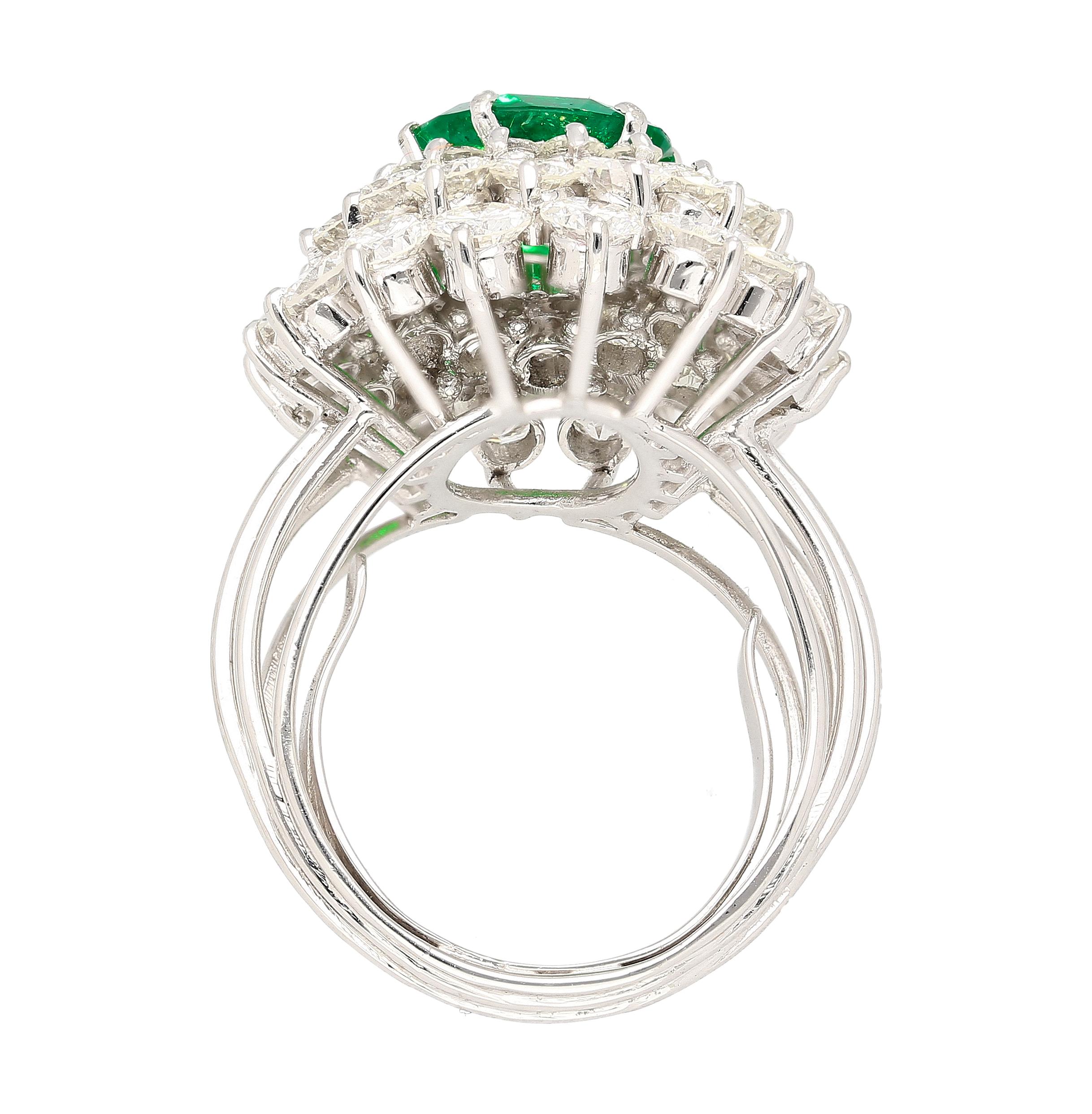 Art Deco 3.19 Carat Oval Cut Emerald Minor Oil & Diamond Cluster Platinum Vintage Ring For Sale