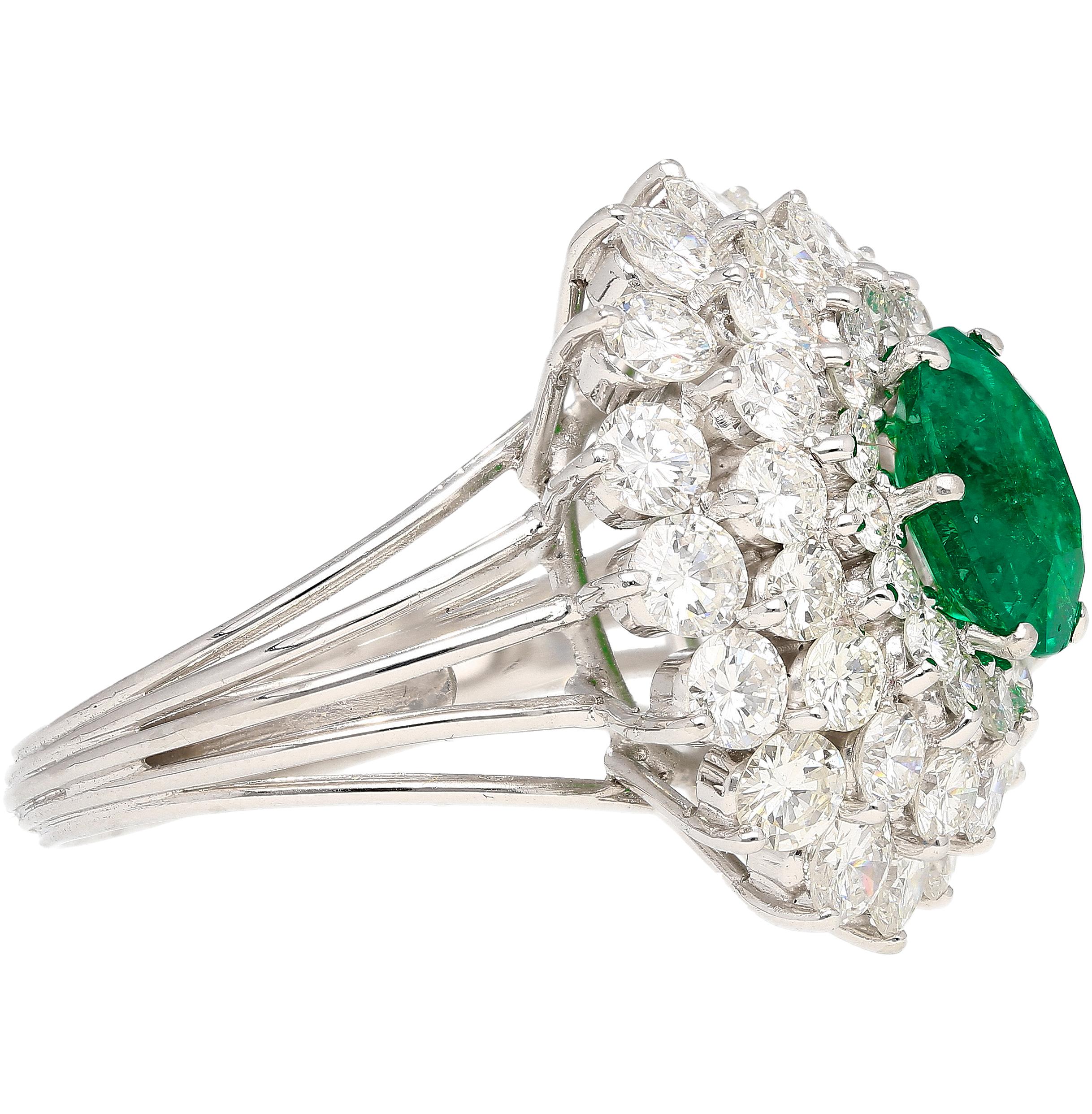 3.19 Carat Oval Cut Emerald Minor Oil & Diamond Cluster Platinum Vintage Ring In New Condition For Sale In Miami, FL