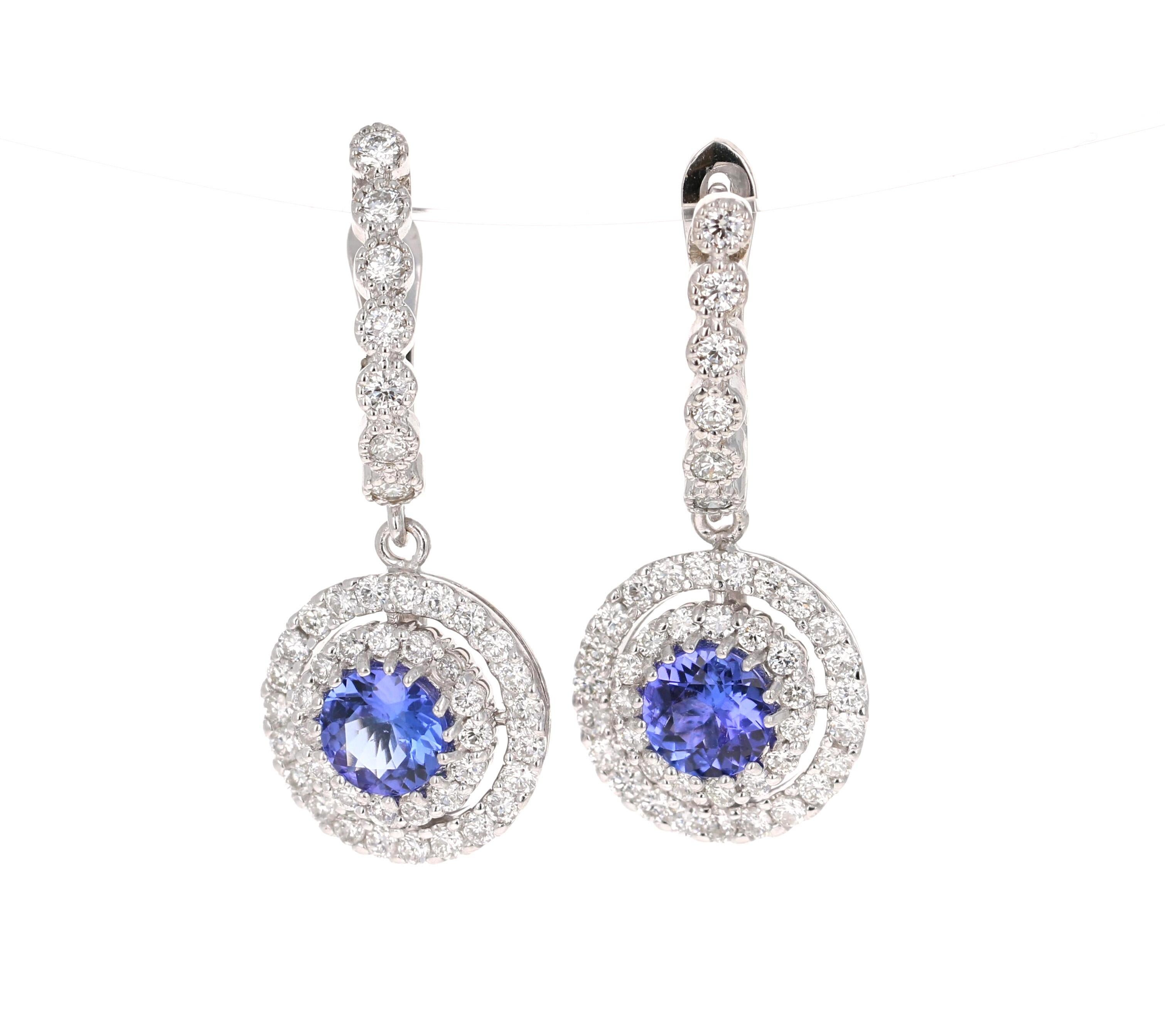 The most stunning Tanzanite diamond earrings! Classy and Chic!

These beauties have 2 Round Cut Tanzanites that weigh 1.51 Carats and 91 Round Cut Diamonds that weigh 1.68 Carats. The total carat weight of the earrings are 3.19 Carats. (Clarity: