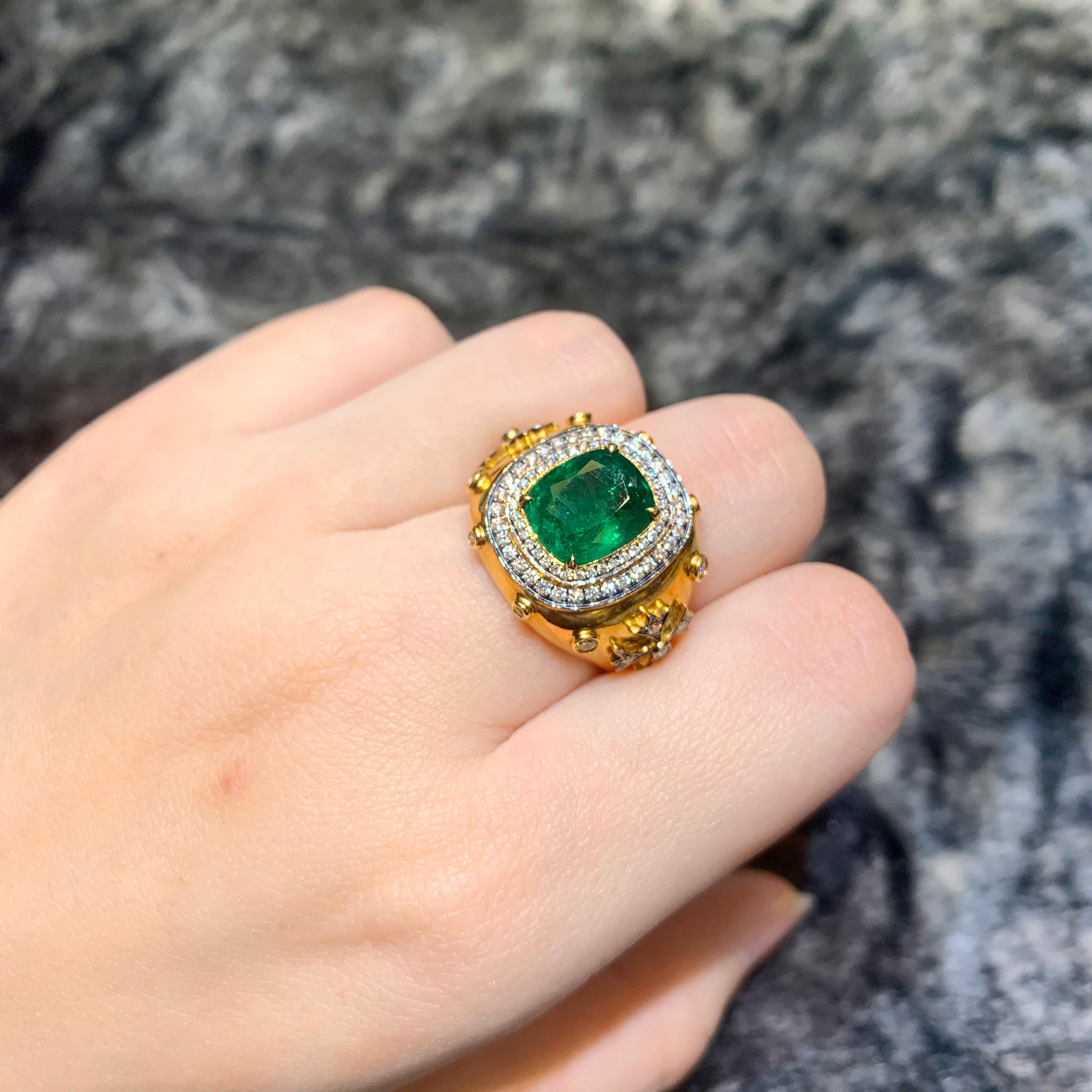 The ring has 3.19 carat of Vivid Green Zambian Emerald in an antique setting accompanied with 0.53 carat of white round brilliant diamond.