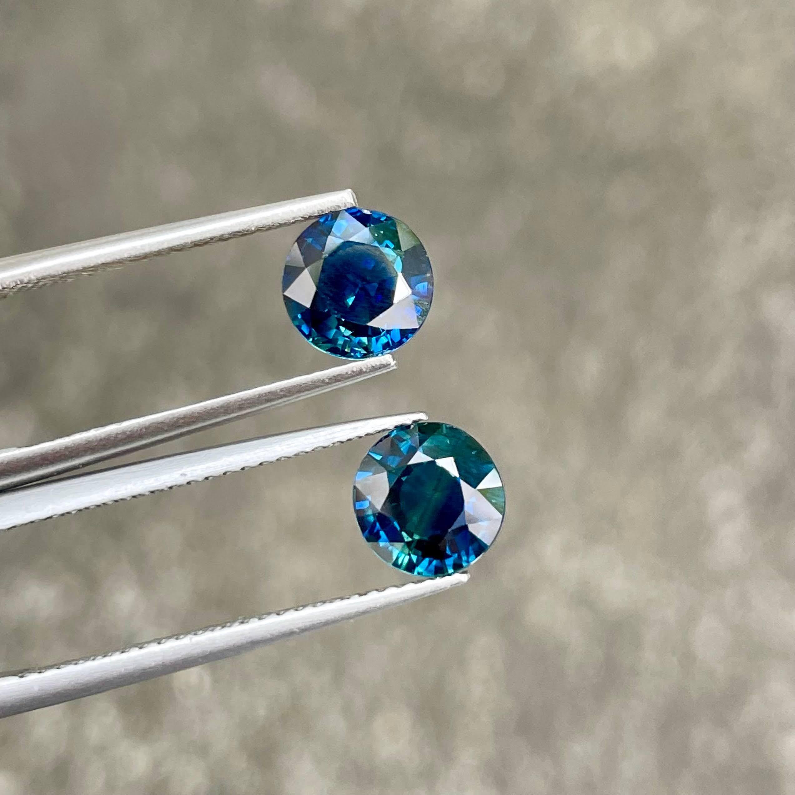 Weight 3.19 carats 
Dimensions 7.0x4.0 mm
Treatment Heated 
Clarity VVS
Origin Madagascar 
Shape round 
Cut round brilliant 




Behold the mesmerizing beauty of a 3.19 carat pair of Teal Blue Sapphires, impeccably crafted in a Round Cut to showcase