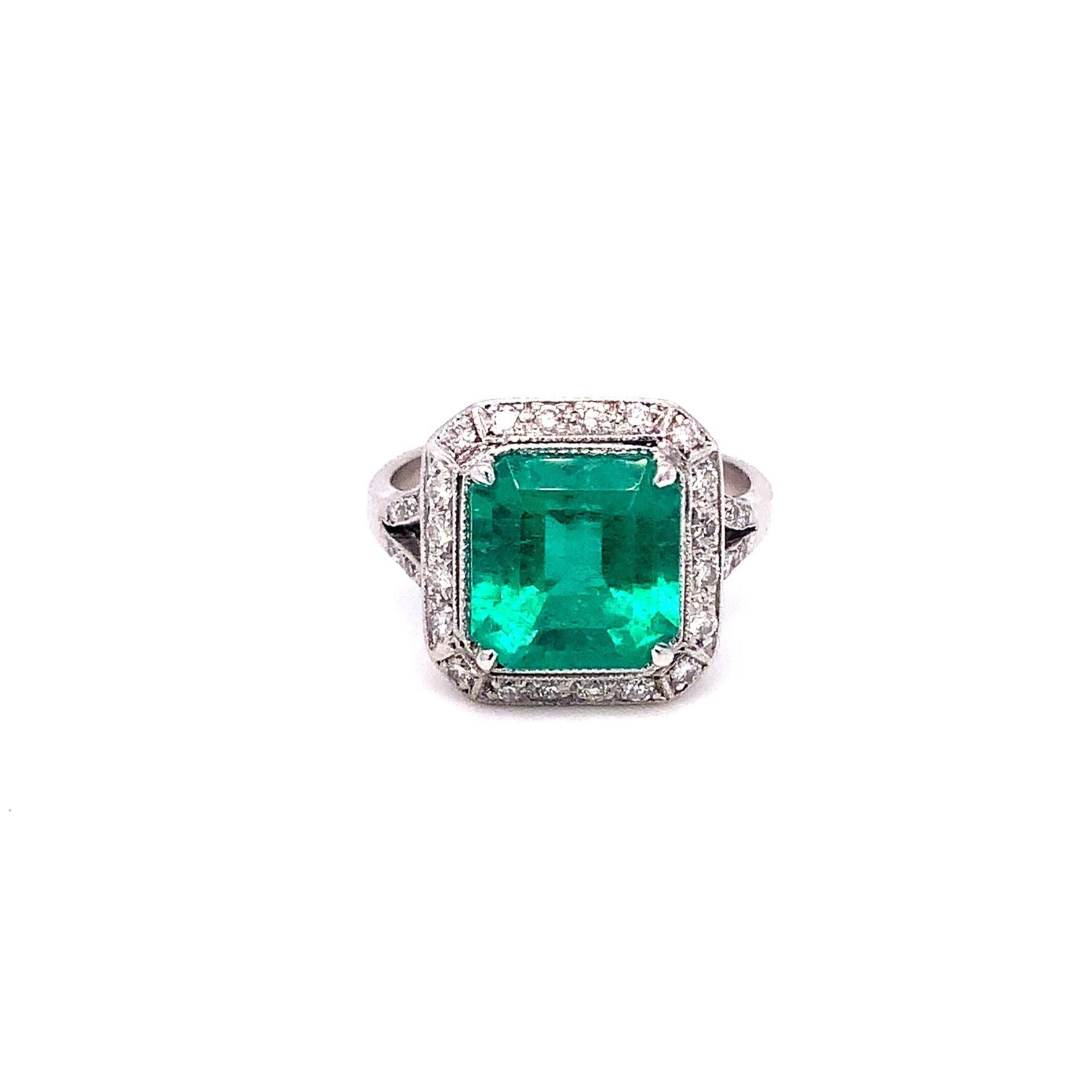 This eye-catching 3.19 ct Vintage Emerald and 0.40 cts t.w. The ring is set in 18 kt White Gold and makes a statement with its stunning combination of green and white. The bold emerald is beautifully framed by the diamond accents, making this piece