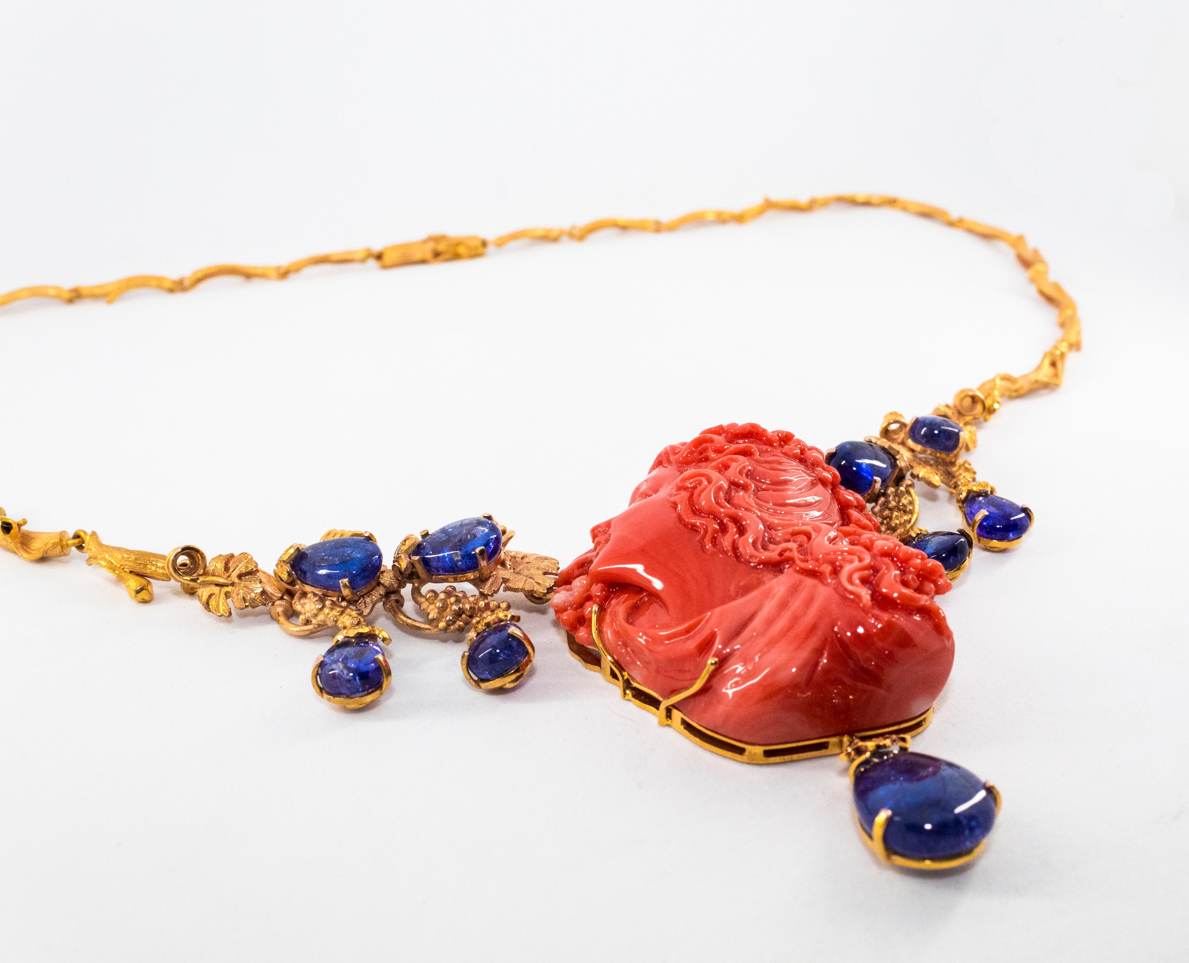 Classical Greek 31.93 Carat Tanzanite White Diamond Red Carved Coral Yellow Gold Greek Necklace