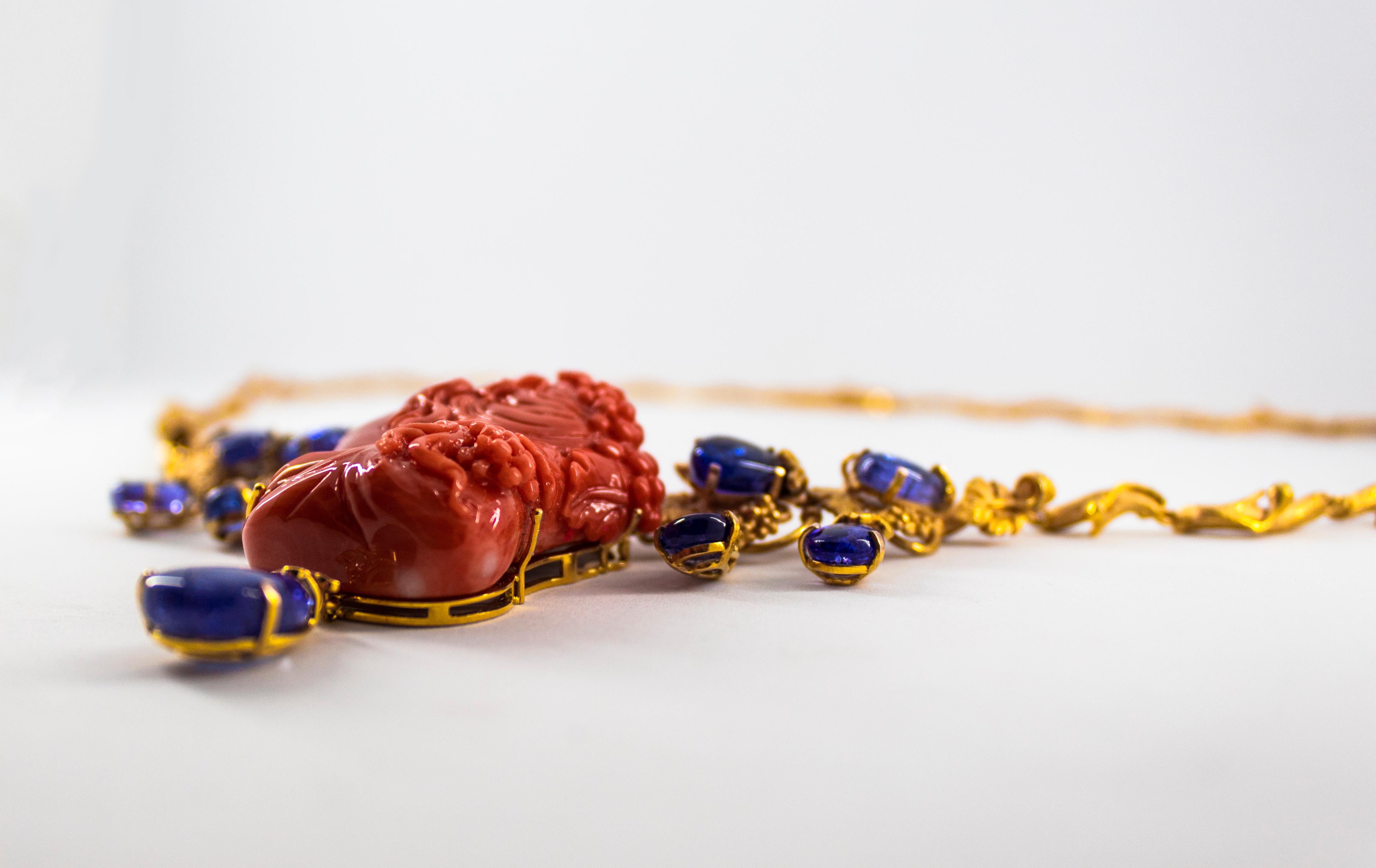 Classical Greek 31.93 Carat Tanzanite White Diamond Red Carved Coral Yellow Gold Greek Necklace