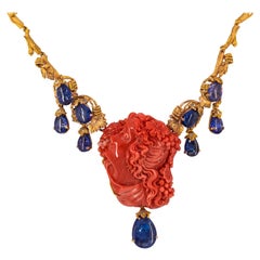 31.93 Carat Tanzanite White Diamond Red Carved Coral Yellow Gold Greek Necklace