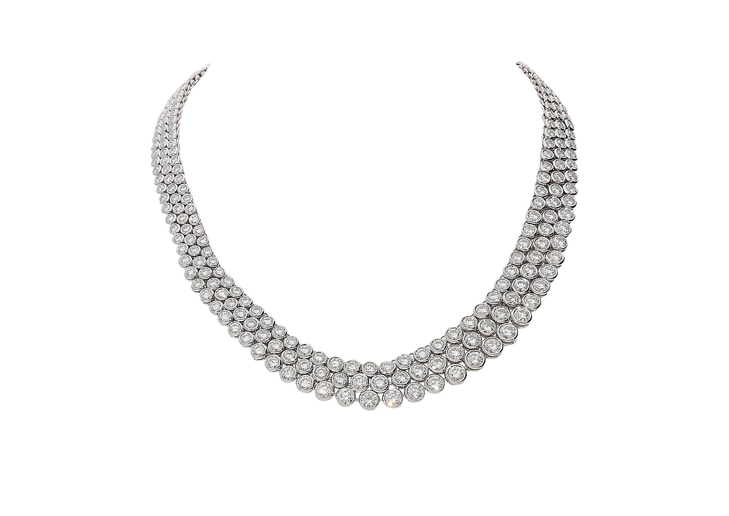 Stunning 3 rows tennis necklace with white round brilliant diamonds color G clarity VS for 31.98 carats. Each row sets different diamond sizes, from smaller to bigger in the front.
Its weight is 60,30 grams of 18kt white gold, 1,30 centimeters of