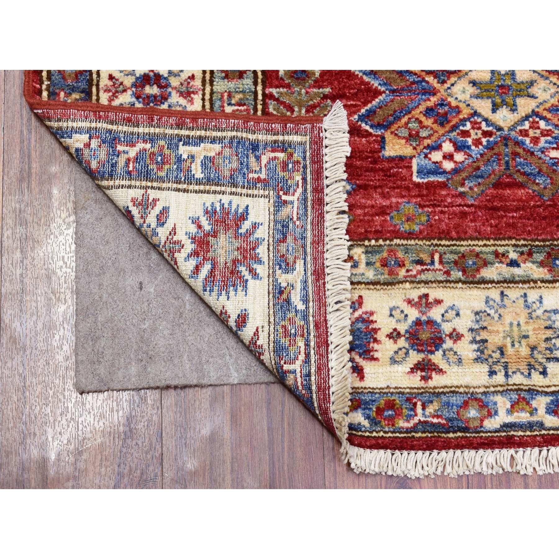 This is a truly genuine one-of-a-kind Rich Red Hand Knotted Kazak with Geometric Medallions Wool Runner Rug. It has been Knotted for months and months in the centuries-old weaving craftsmanship techniques by expert artisans.
Primary materials:
