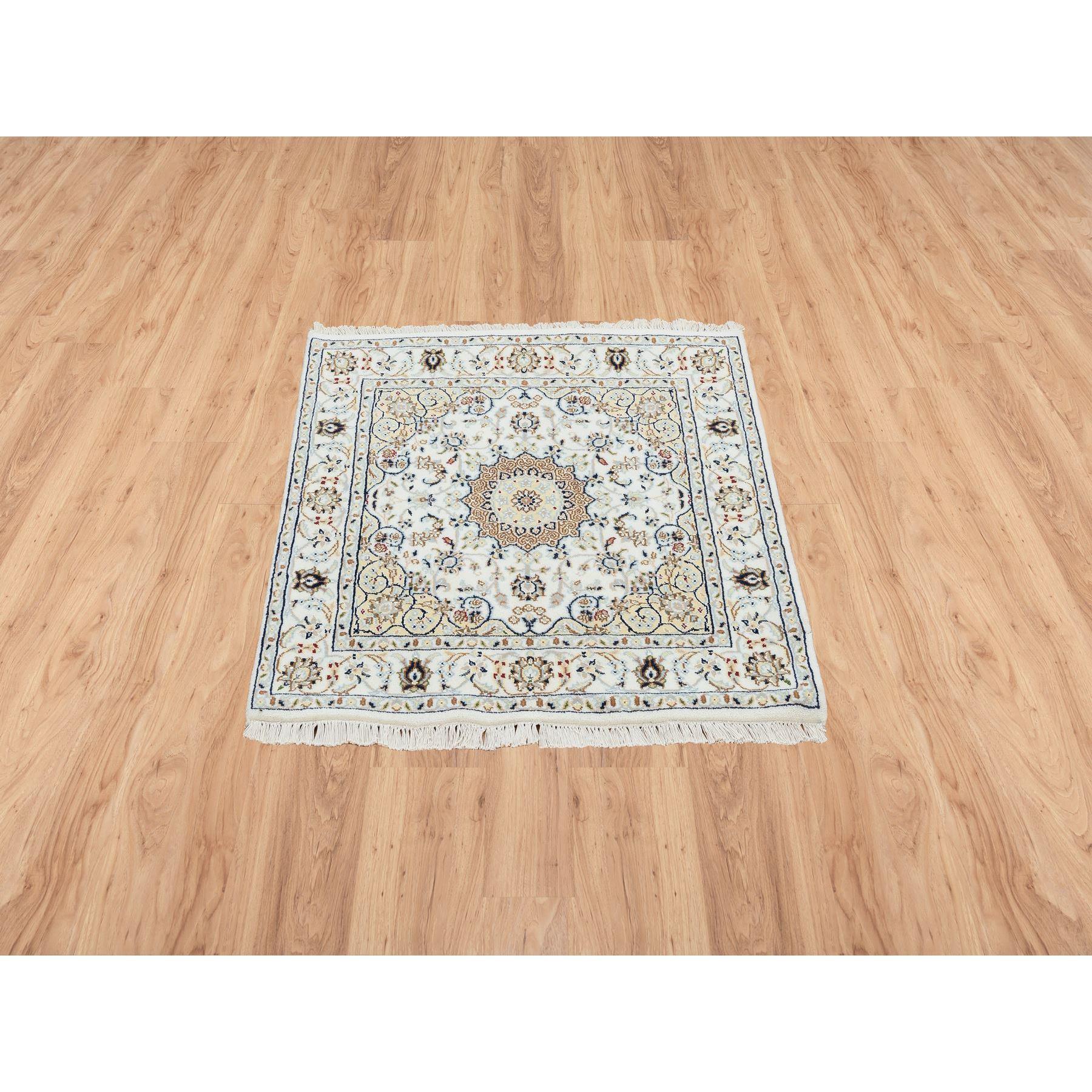 Ivory, 250 KPSI, Nain with Flower Medallion Design, Wool, Hand Knotted, Square Oriental Rug
Primary materials: Wool
Latex: No Pile 
height: 0.25 Inches
Style: Traditional
Primary color: Ivory
Secondary colors: Red, Green, Brown, Light Blue, Midnight