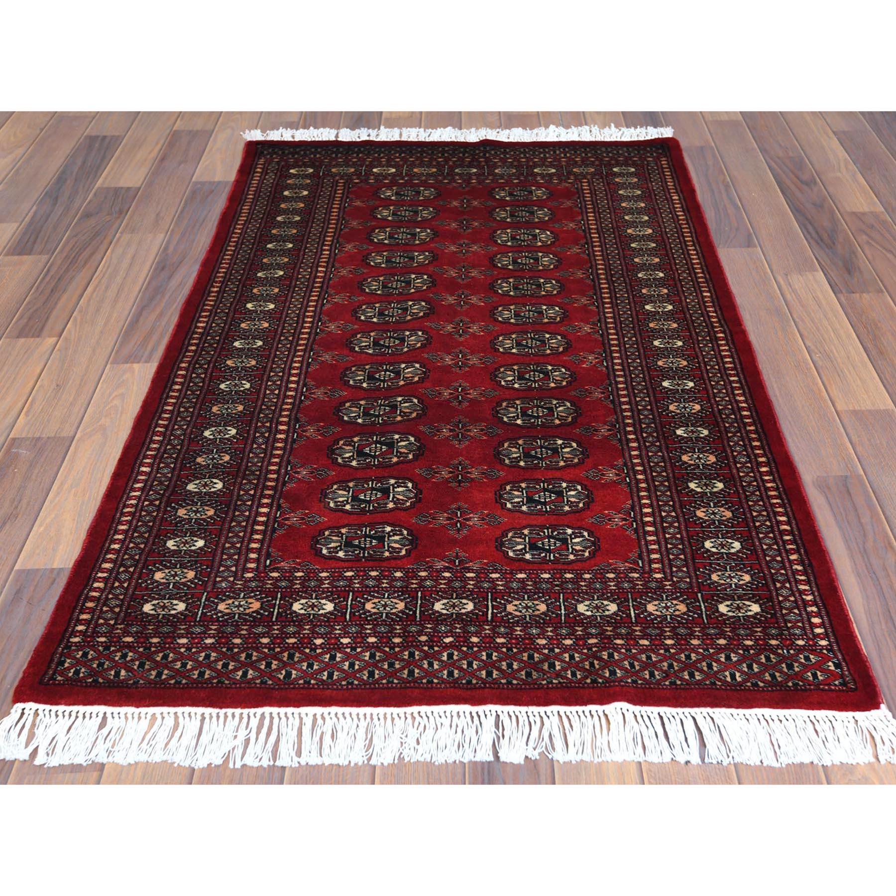 This is a truly genuine one-of-a-kind Hand Knotted Saturated Red Denser Weave Silky Wool 250 KPSI Super Bokara Oriental Rug. It has been Knotted for months and months in the centuries-old Persian weaving craftsmanship techniques by expert