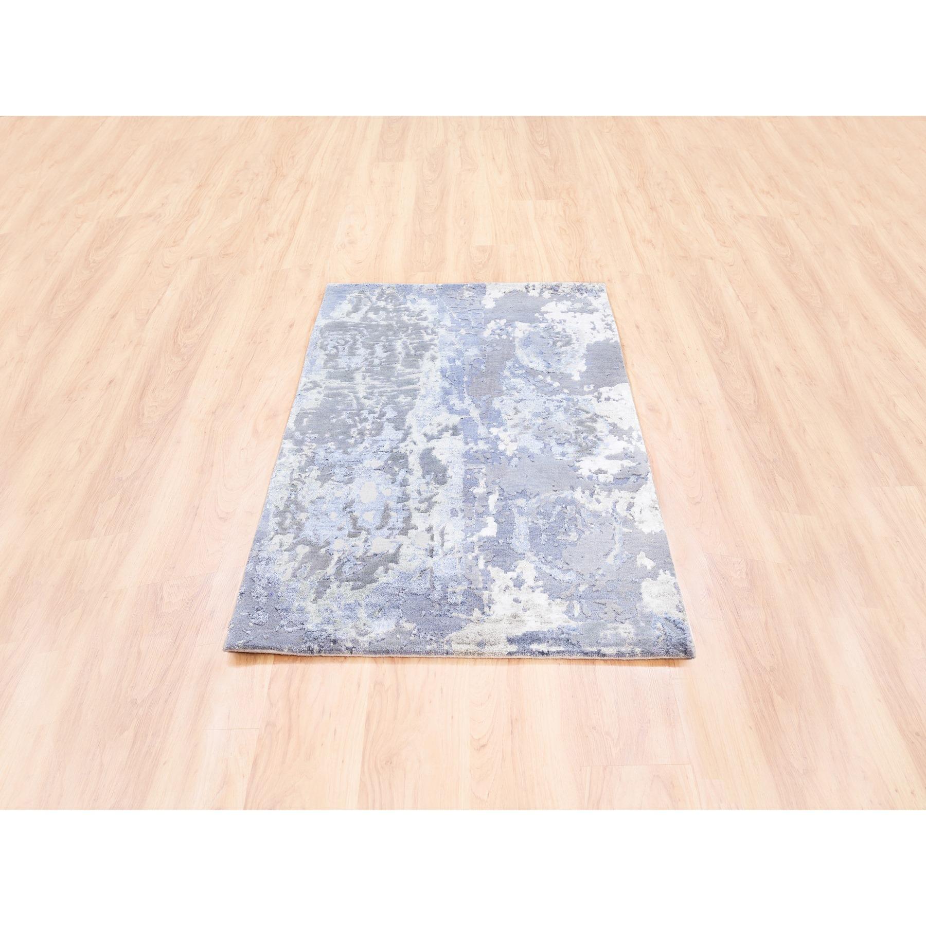 This is a truly genuine one-of-a-kind Wool and Silk Gray and Silver Blue Abstract Design Hand Knotted Modern Oriental Rug. It has been Knotted for months and months in the centuries-old Persian weaving craftsmanship techniques by expert