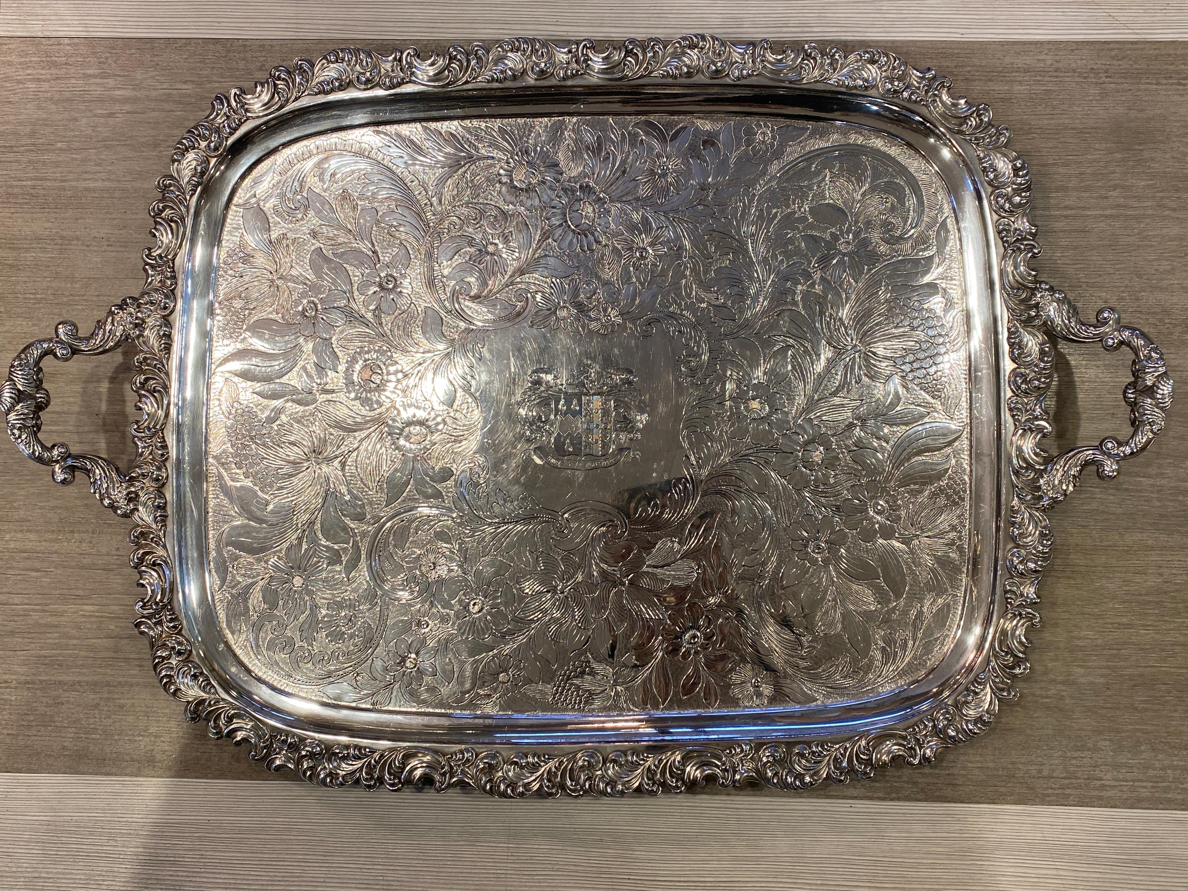Up for your consideration is this very large and extremely fine early 19th century Old Sheffield shaped oblong handled tea tray.   The tray features a deep set, and heavily ornate scrolling border with elegant handles decorated with acanthus leaves