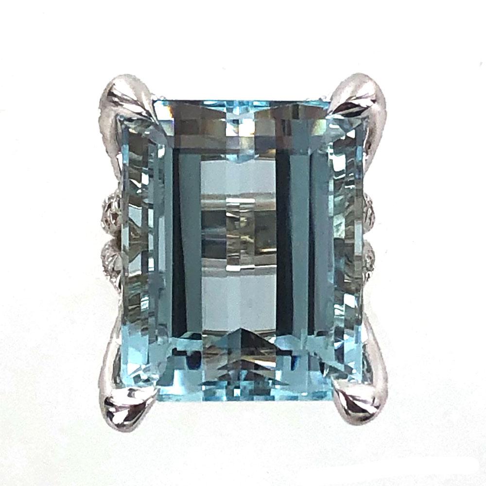 Fabulous aquamarine diamond cocktail ring. This new ring was custom made for the 32.03 carat blue aquamarine gemstone. The aqua measures 17 x 21mm and is mounted in 18 karat gold. The custom mounting features 2.50 carats of high quality round