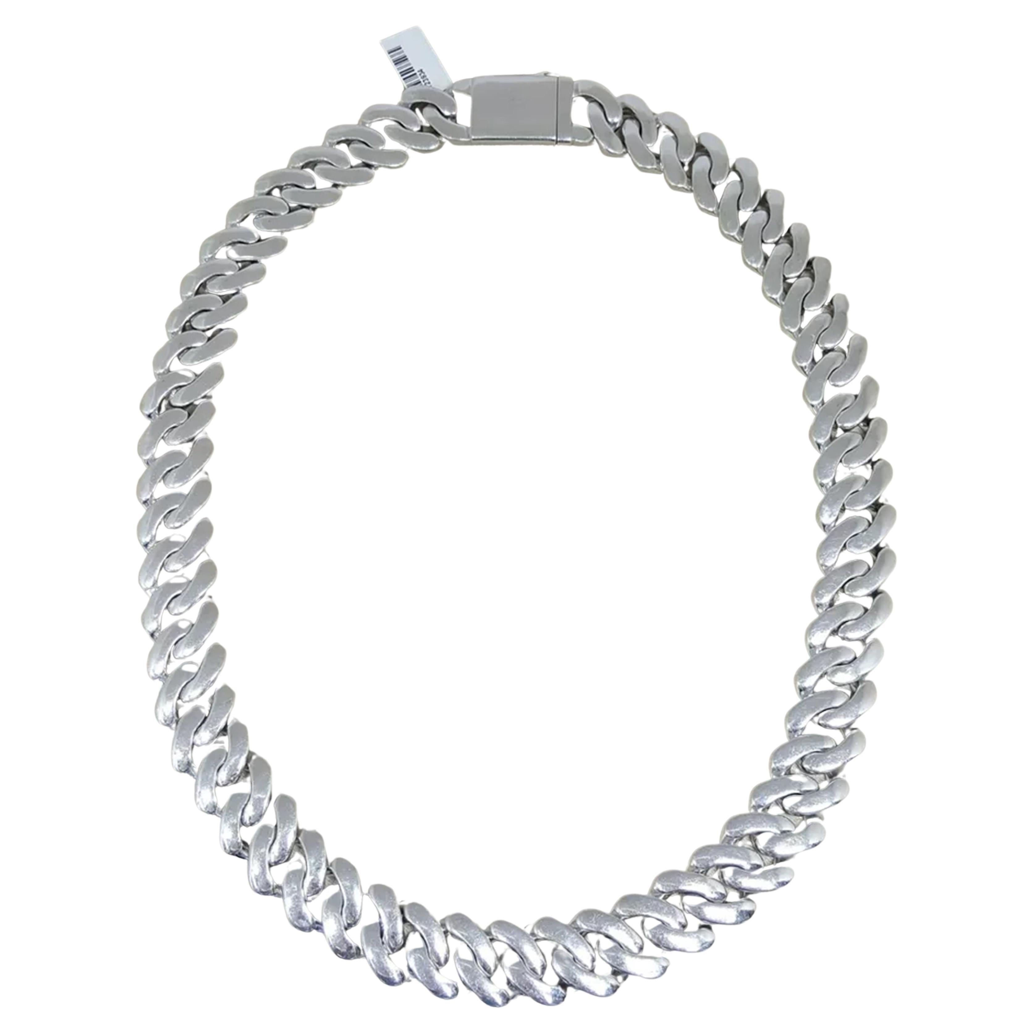 32 ct Total Weight Round Brilliant Cut Diamonds Cuban Link Chain Necklace is a stunning and bold piece of jewelry. The necklace weighs 316.4 grams and measures 22 inches in length, with a width of 18 mm and a thickness of 4.6 mm, increasing to 8 mm