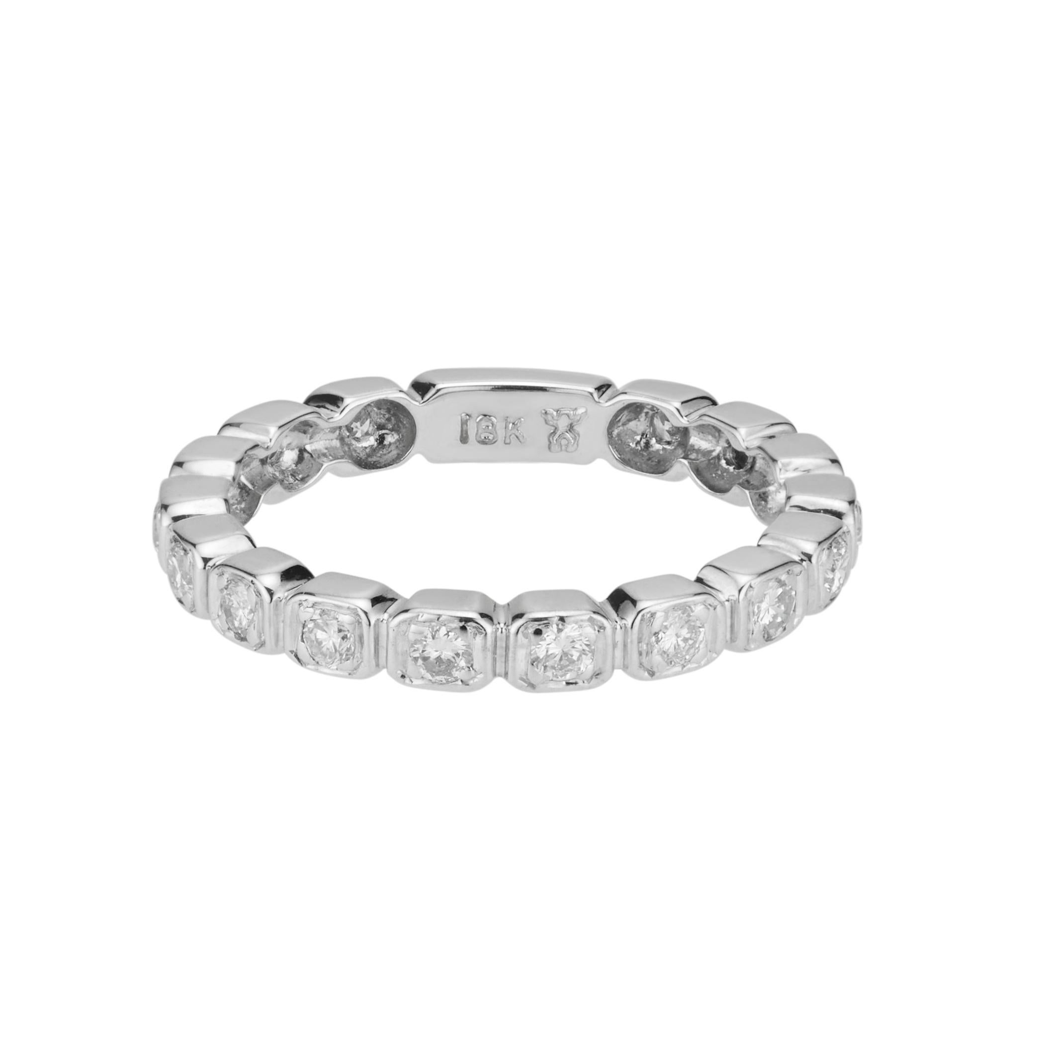 Diamond wedding band. 16 round brilliant cut diamonds totaling .32cts in a 18k white gold setting.  

16 round brilliant cut diamonds, H VS SI approx. .32cts
Size 6.75 and sizable
18k white gold 
Stamped: 18k
2.8 grams
Width at top: 2.8mm
Height at