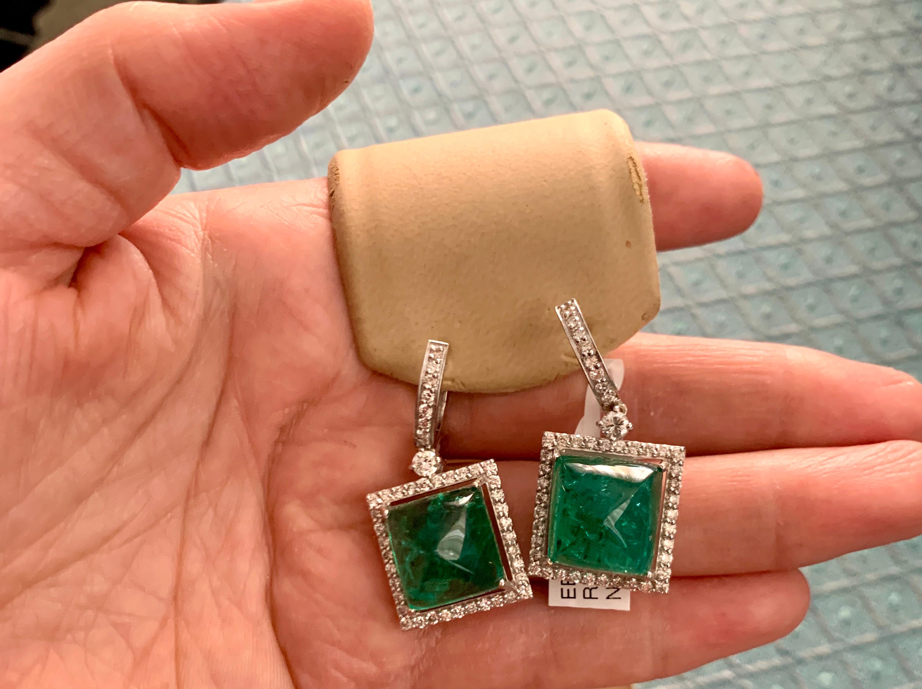 32 Carat Natural Zambian Emerald Sugar loaf Cabochon & Diamond Earrings 18 K G 
Perfect pair  of natural Zambian Emerald earring.
Almost Square 1.5 Cm on each side length and width , this Sugar Loaf earrings are spectacular.
Each emerald is