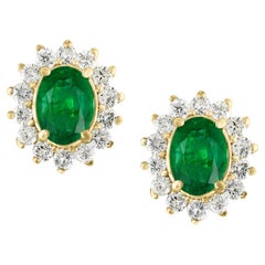 4 Carat Oval Shape Emerald and Diamond Post Back Earrings 14 Karat Yellow Gold