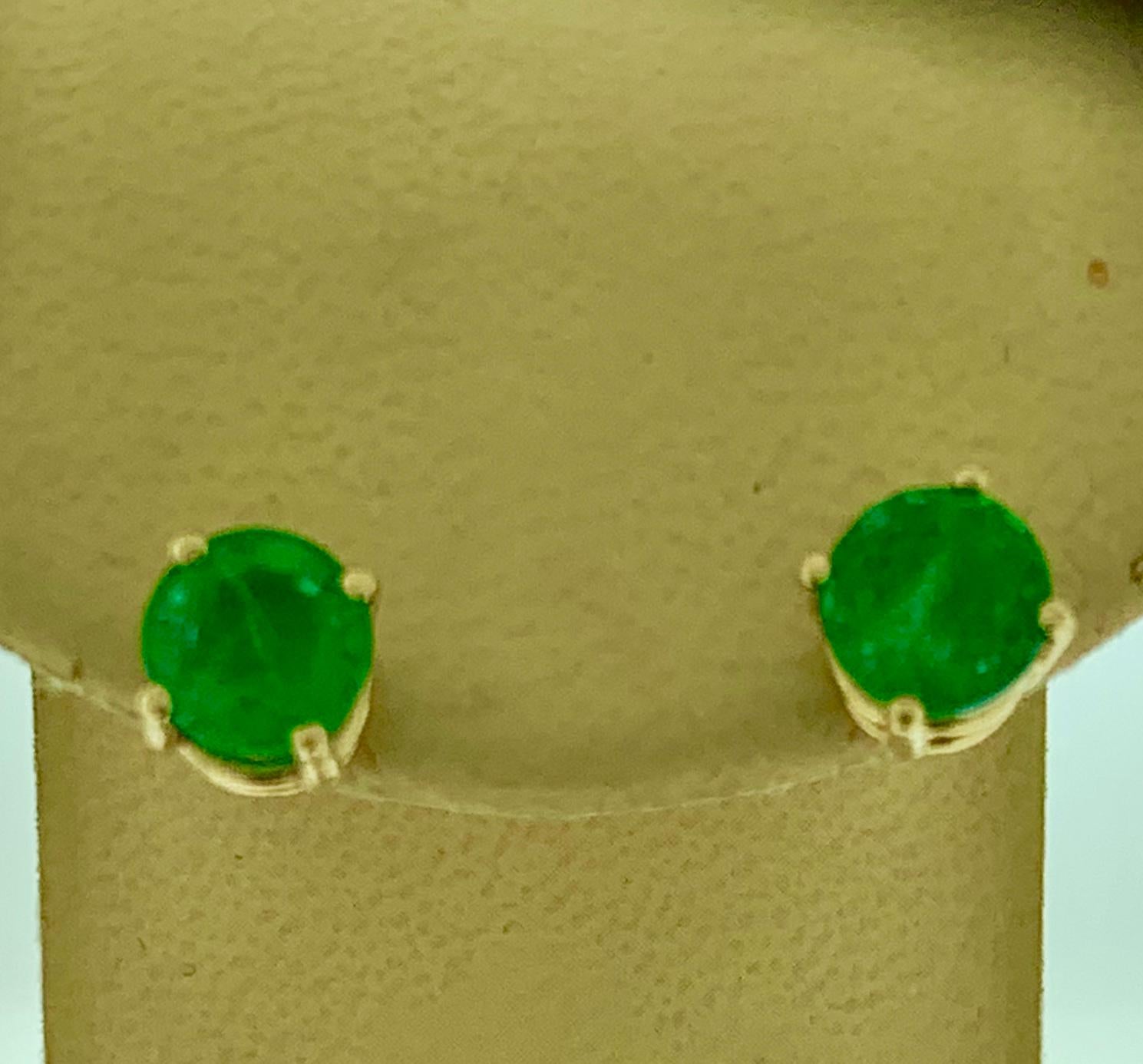 

3.2 Carat  Round Cut Emerald  perfect pair  Post  Earrings  14 Karat  Yellow Gold 
This exquisite pair of earrings are beautifully crafted with 14 karat  Yellow gold .
Weight of 14 K gold 2.5 grams
 Fine  Round Cut Emeralds weighing approximately