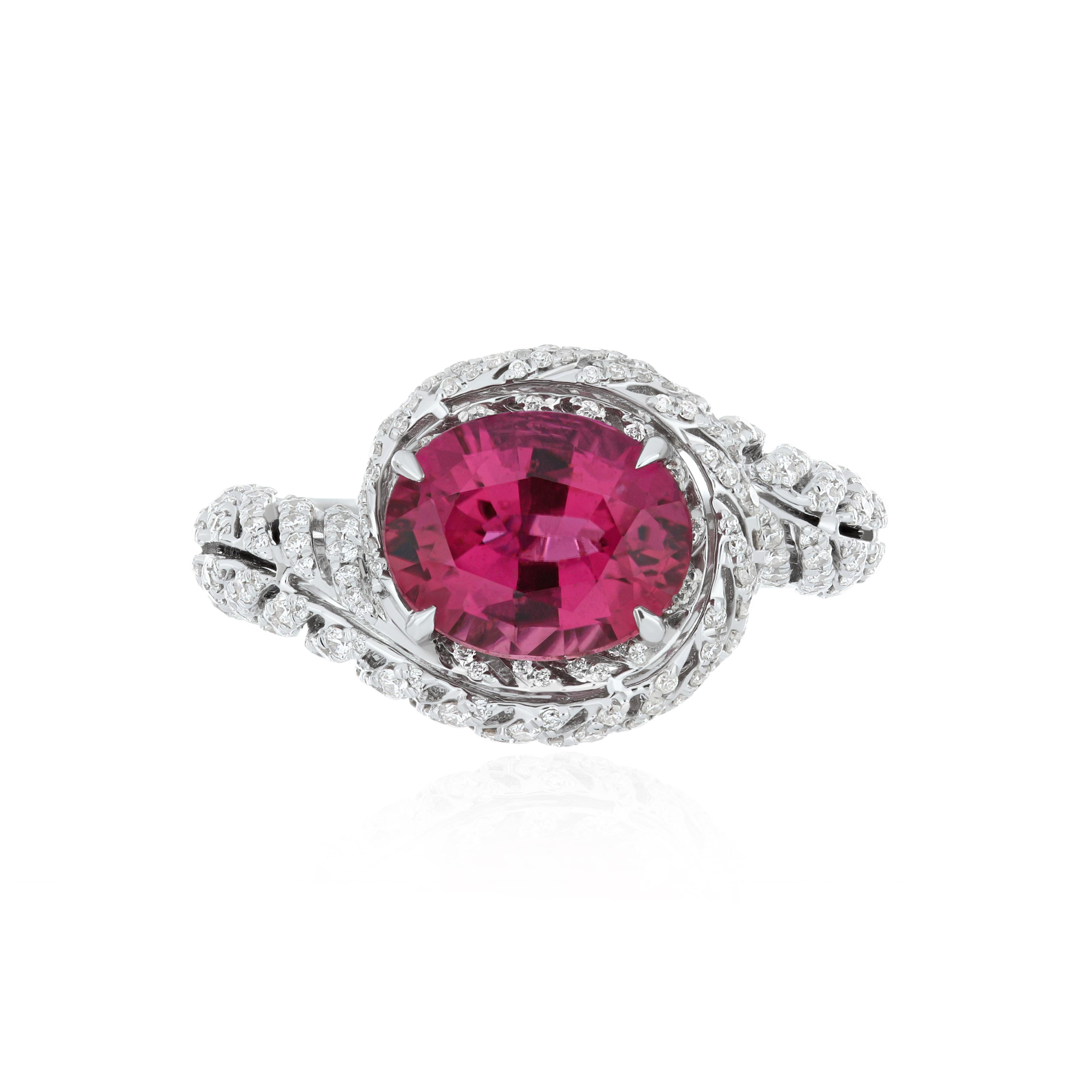 Elegant and exquisitely detailed 18K White Gold Ring, with 3.20 Cts Oval Shape Rubellite set in center and Surrounded by Micro pave Diamonds, weighing approx. 0.98 CT's. total carat weight and Ring to further enhance the beauty of the ring.