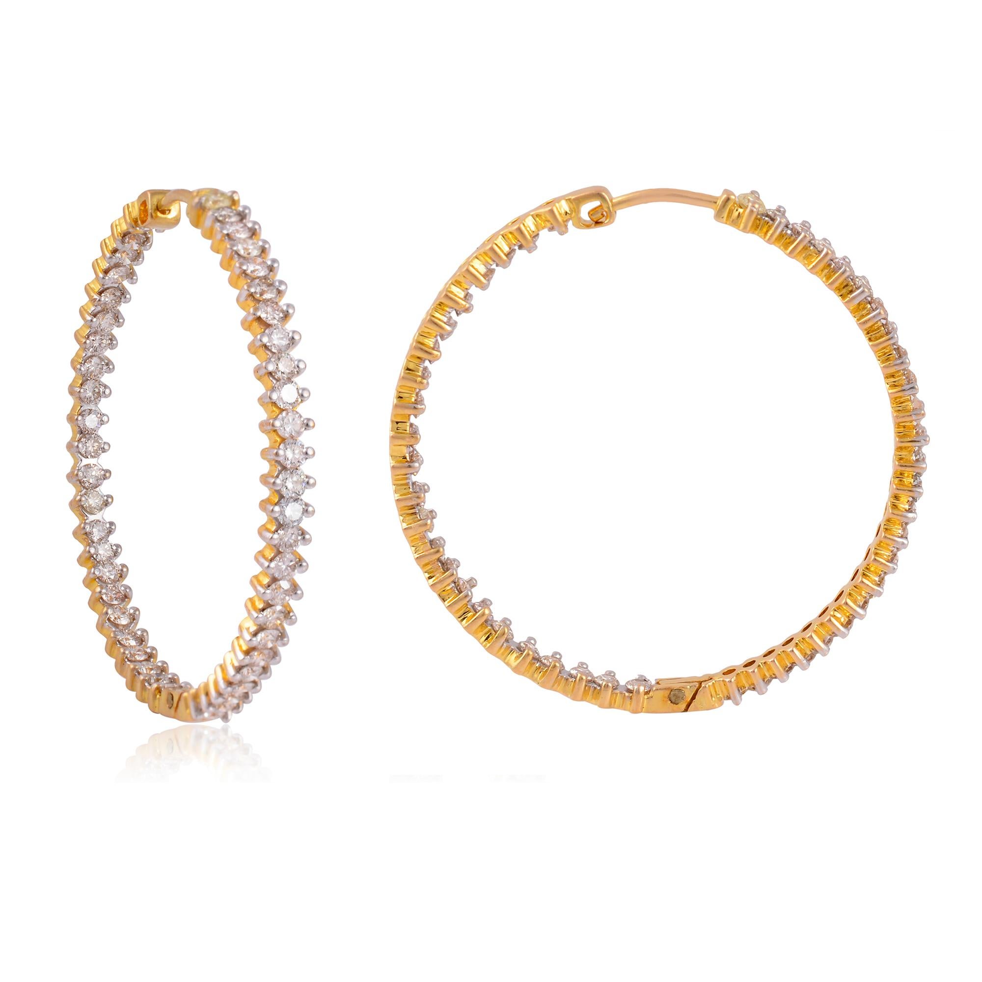 The diamonds are set in 14 karat yellow gold, a beautiful and classic choice for fine jewelry. Yellow gold has a warm and rich tone that complements the brilliance of the diamonds.
The hoop design adds a touch of elegance and versatility to the