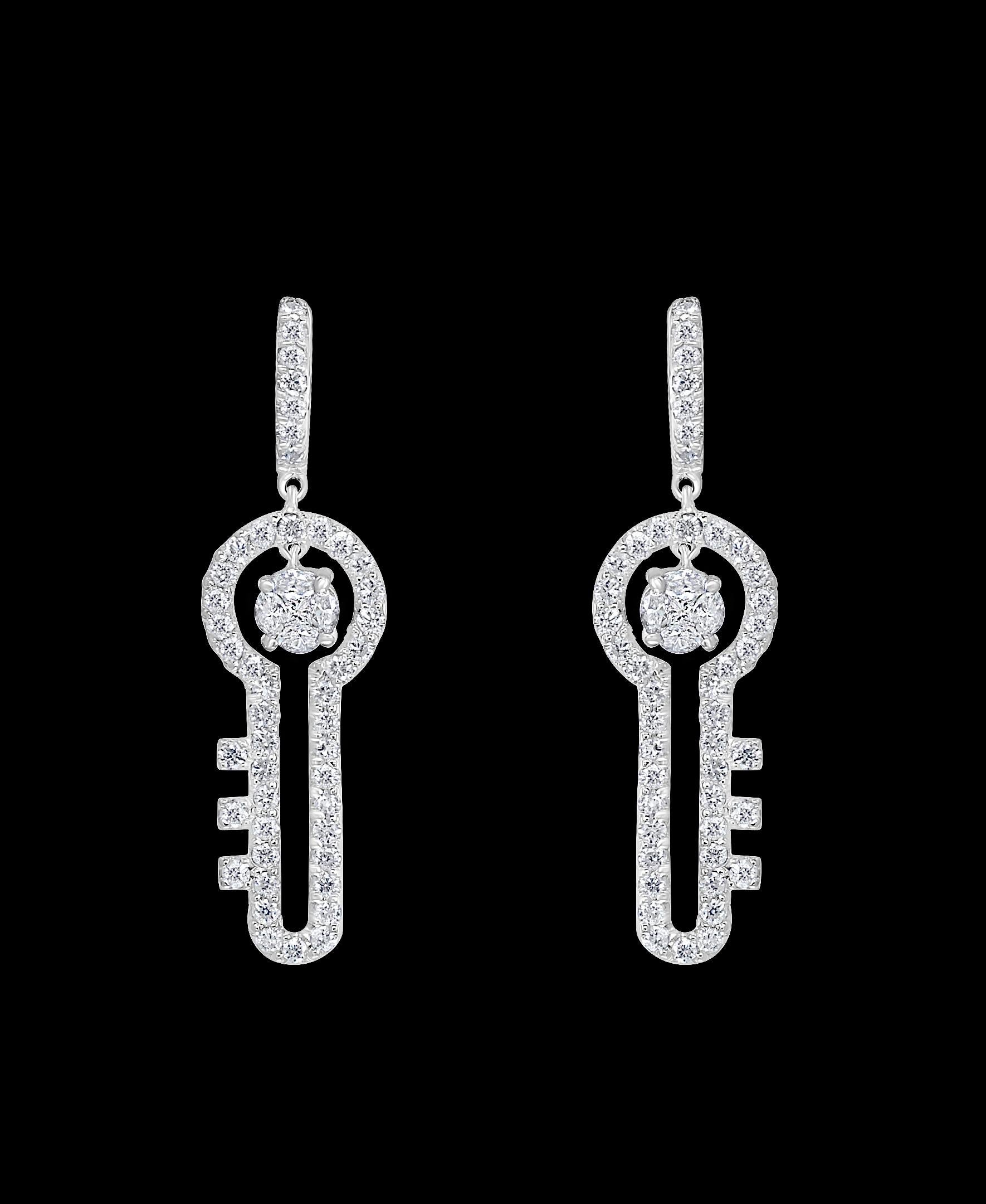 3.2 Ct Diamond Drop Cocktail  Key Shape Earrings in 14 Karat White Gold 8 Grams
A fabulous pair of earrings with an enormous amount of look and sparkle!
These exquisite pair of earrings features several  brilliant cut round diamond in each earring .