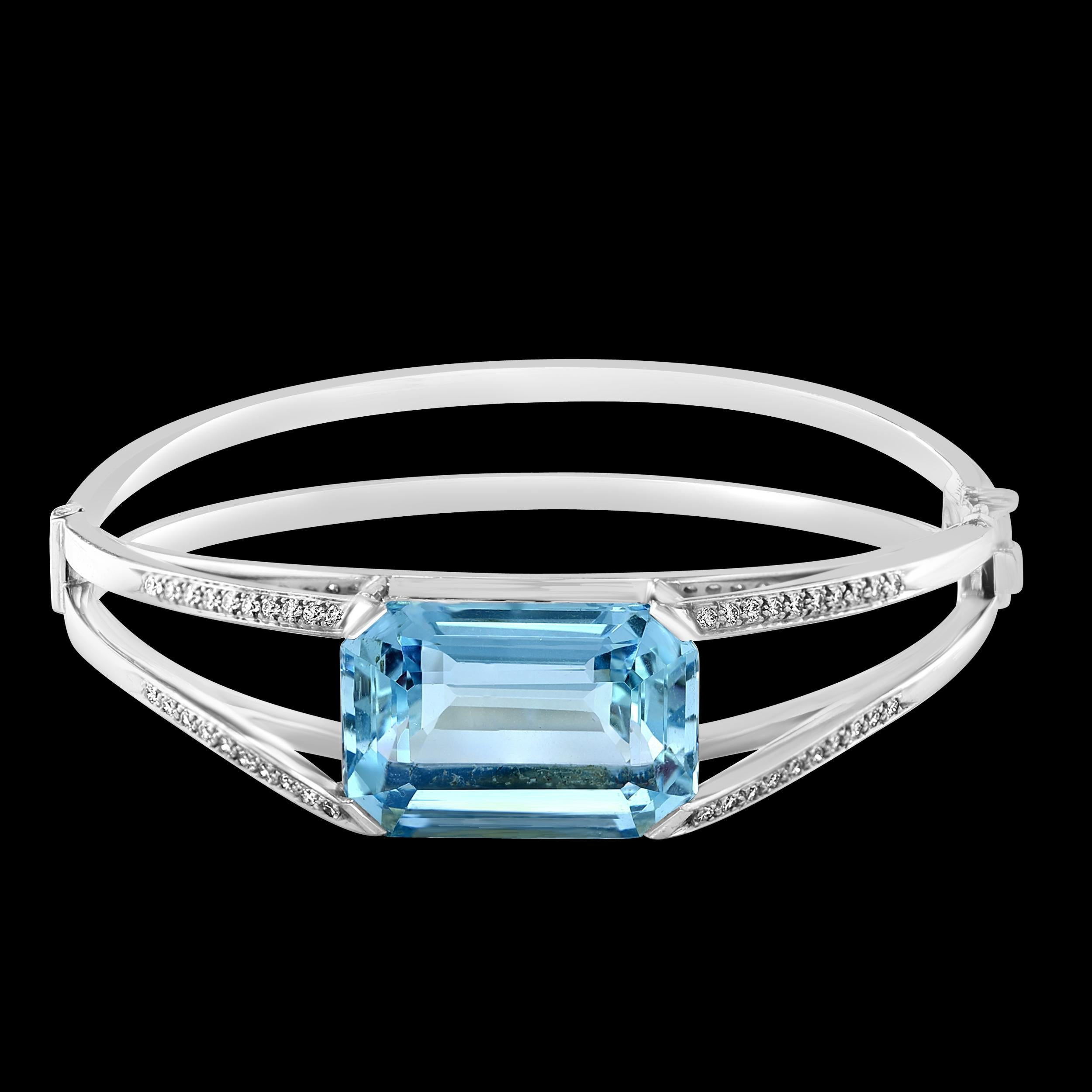 32 Ct Natural Aqua & Diamond Bangle /Bracelet in 18 Karat White Gold 46 Grams
It features a bangle style  Bracelet crafted from  18 karat White gold and embedded with  total approximately 1.2 Carats of Round brilliant diamonds  . 
There is a 32 ct
