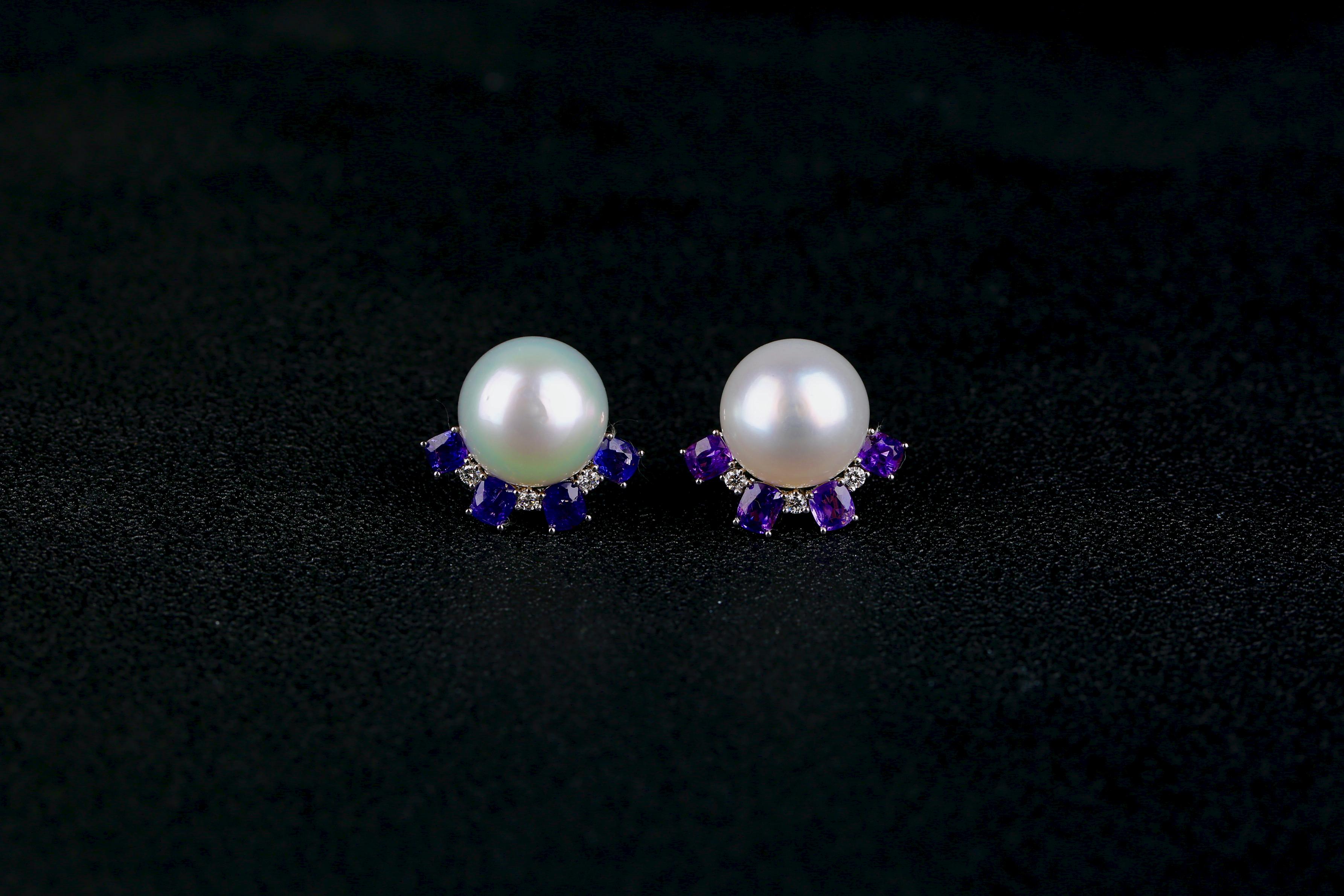 A pair of 14 mm South Sea Pearl, Purple Sapphire and Diamond Earring in 18k White Gold
It consists of a total of 3.21 ct purple sapphire
Total natural diamond weight 0.21 ct , The Colour of the Diamond is Approximately E/F with VS Clarity
