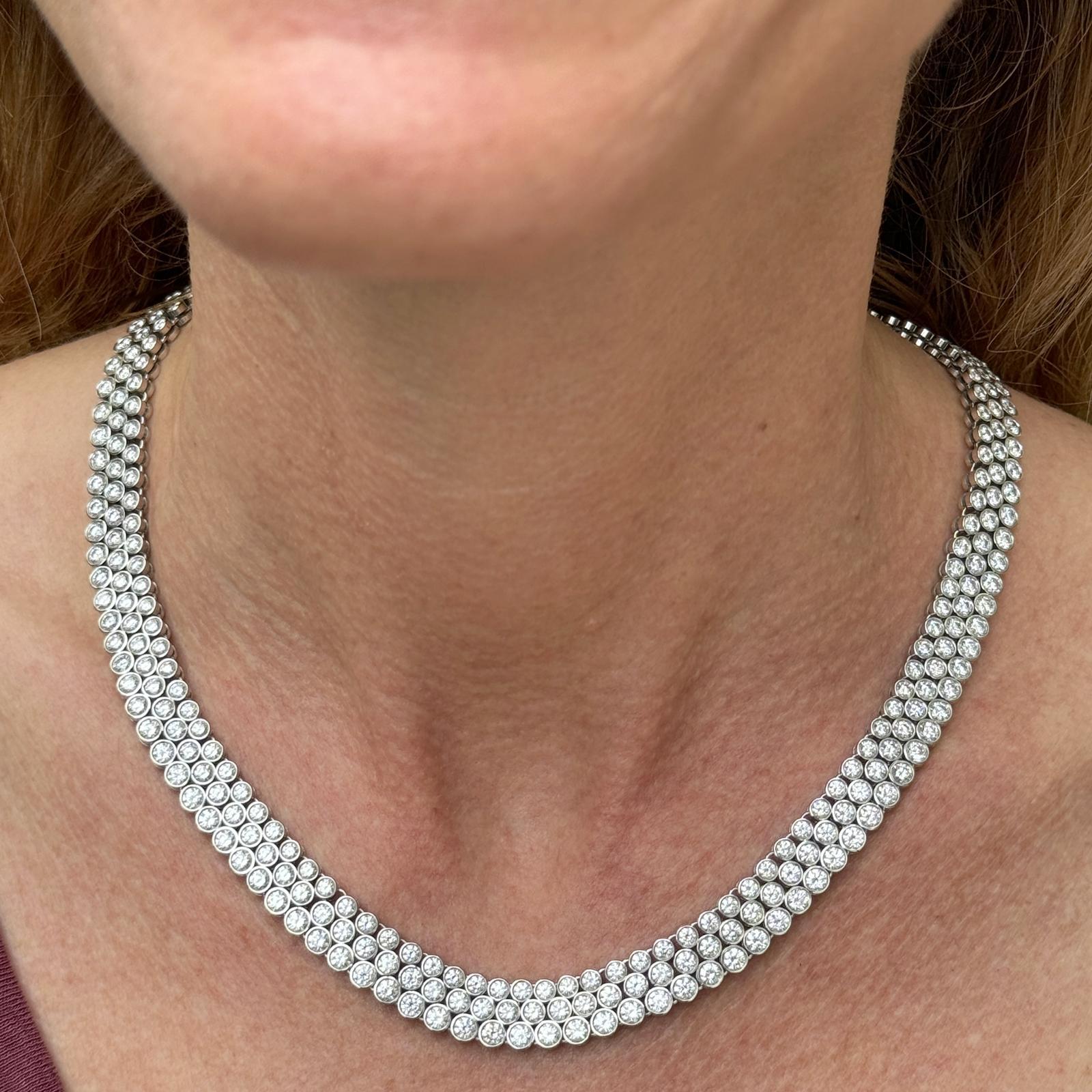 Stunning Three Row Diamond Necklace handcrafted in 18 karat white gold. The bezel set diamond necklace features 333 round brilliant cut diamonds weighing approximately 32 carat total weight. The high quality diamonds are graded F-G color and VS2-SI1