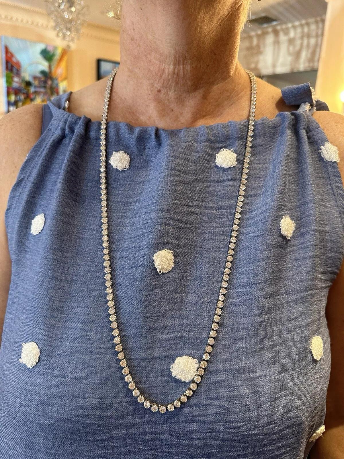 32 inch Vintage Natural Diamond Riviera Necklace 52.00 carat total weight in Platinum

Long Vintage Diamond Tennis Necklace features 160 Round Brilliant Natural Diamonds set in 3 prong setting weighing 52.00 carats in total, all set in Platinum. The