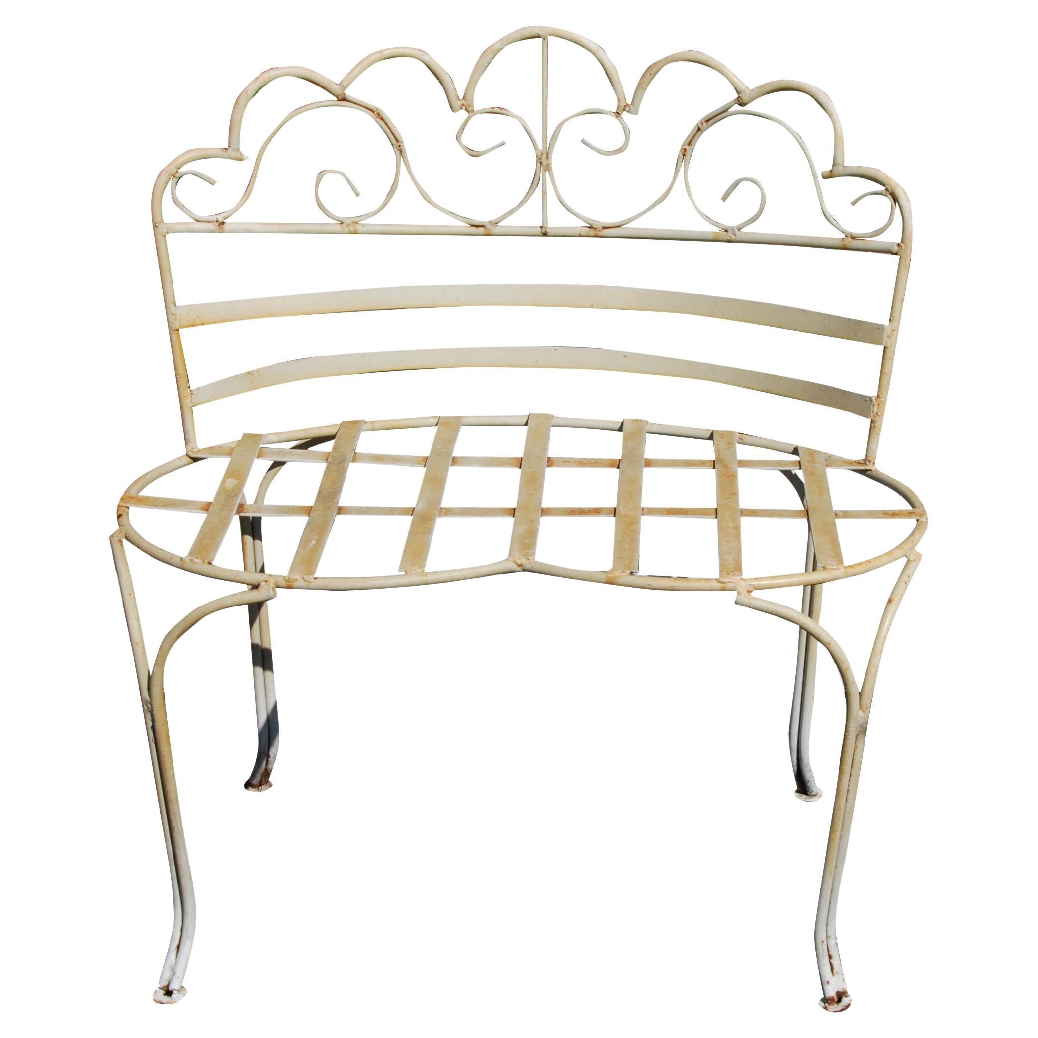 Victorian-Style Wrought Iron Curved Garden Bench

Charming petite wrought iron garden bench with an open and airy design featuring a scalloped, scrolled back and kidney-shaped seat. Rustic original paint finish.