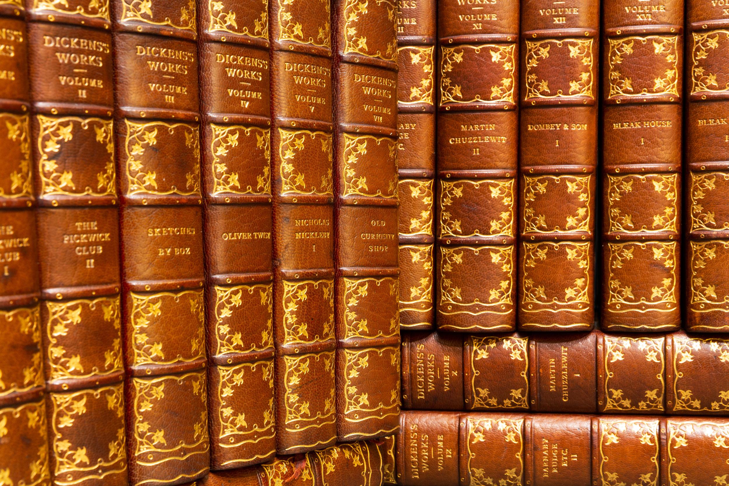 32 Volumes. Charles Dickens. The Complete Works.volume one with an original letter by Charles Dickens Bound in 3/4 brown morocco. Top edges gilt. Raised bands. Illustrated. Gilt tooling on spine. Published: Boston & New York; Houghton, Mifflin and
