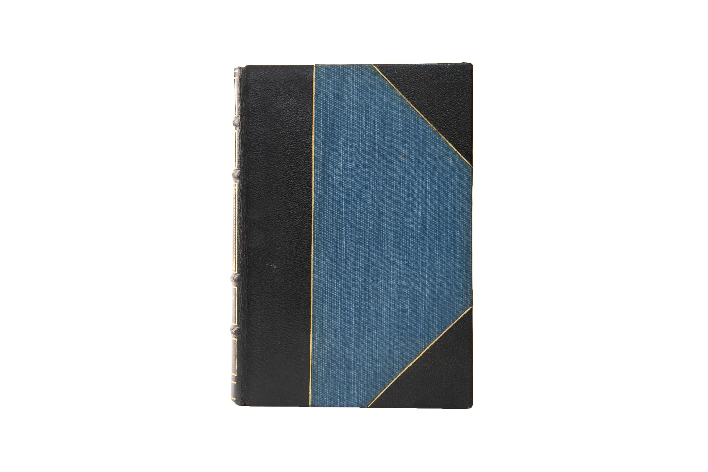 32 Volumes. Robert Louis Stevenson, The Complete Works. Limited Edinburgh Edition. Bound in 3/4 blue morocco and linen boards, bordered in gilt tooling. The spines display raised bands, floral panel details, bordering, and label lettering, all