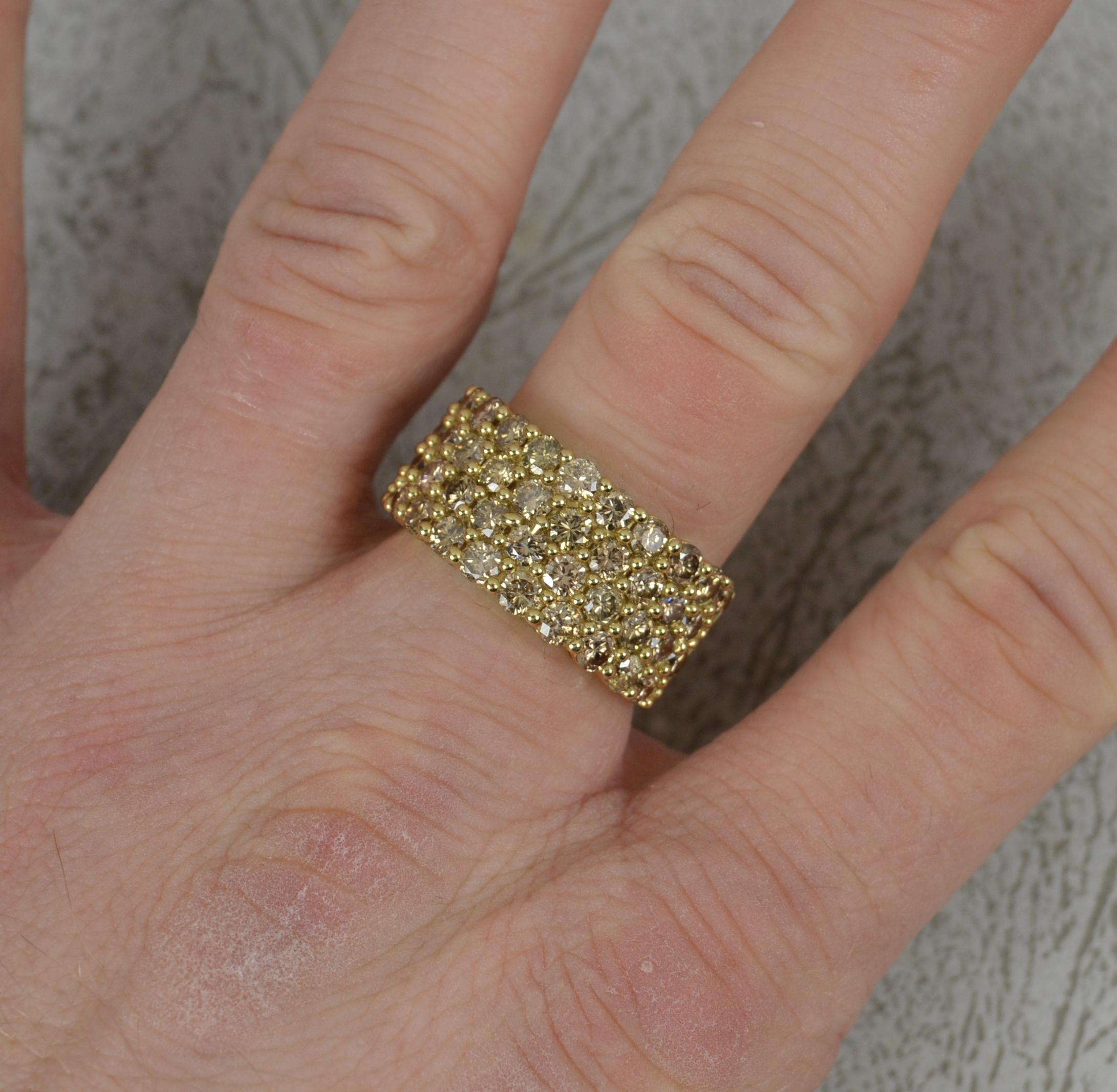 A natural Diamond and 9ct Gold ring.
​Set with four rows of round brilliant cut natural diamonds. Untreated, champagne colour. 3.20 carats in total. Sparkly piece.
Complete with certificate, limited edition of just 21 made.
23mm spread of stones.