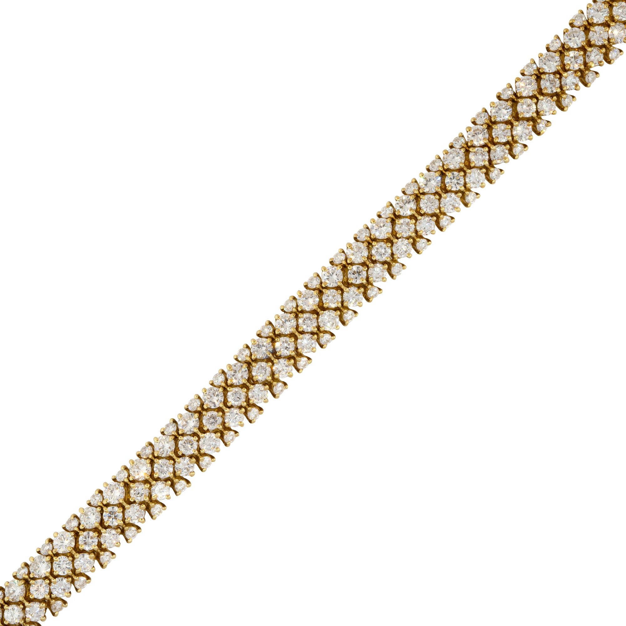 18k Yellow Gold 32.0ctw Flexible 3 Row Diamond Necklace

Material: 18k Yellow Gold
Diamond Details: Approximately 32.0ctw of Round Cut Diamonds. Diamonds are G/H in color and VS in clarity
Chain Details: Tongue in Box Clasp with Safety Lock
Total