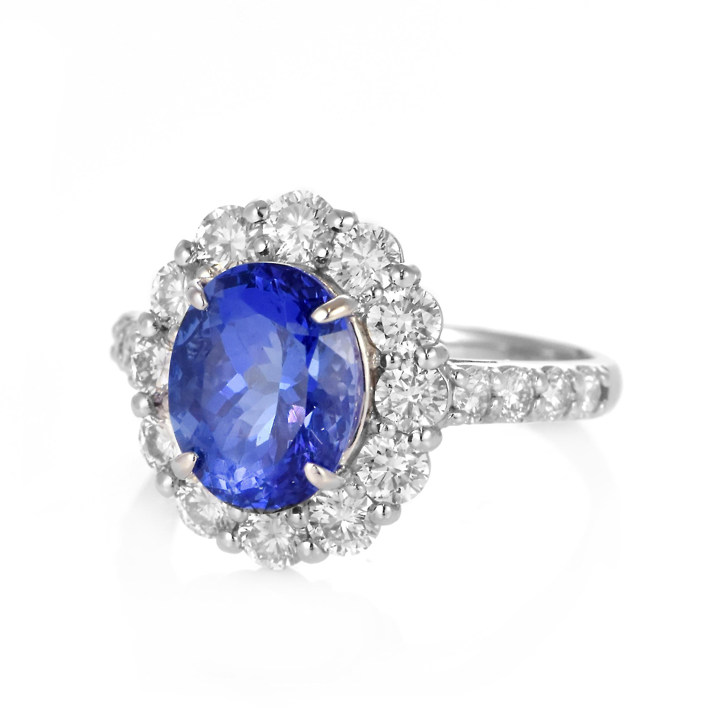 Modern 3.20 Carat Natural 'AAA' Tanzanite and Diamond Ring Made in Platinum For Sale