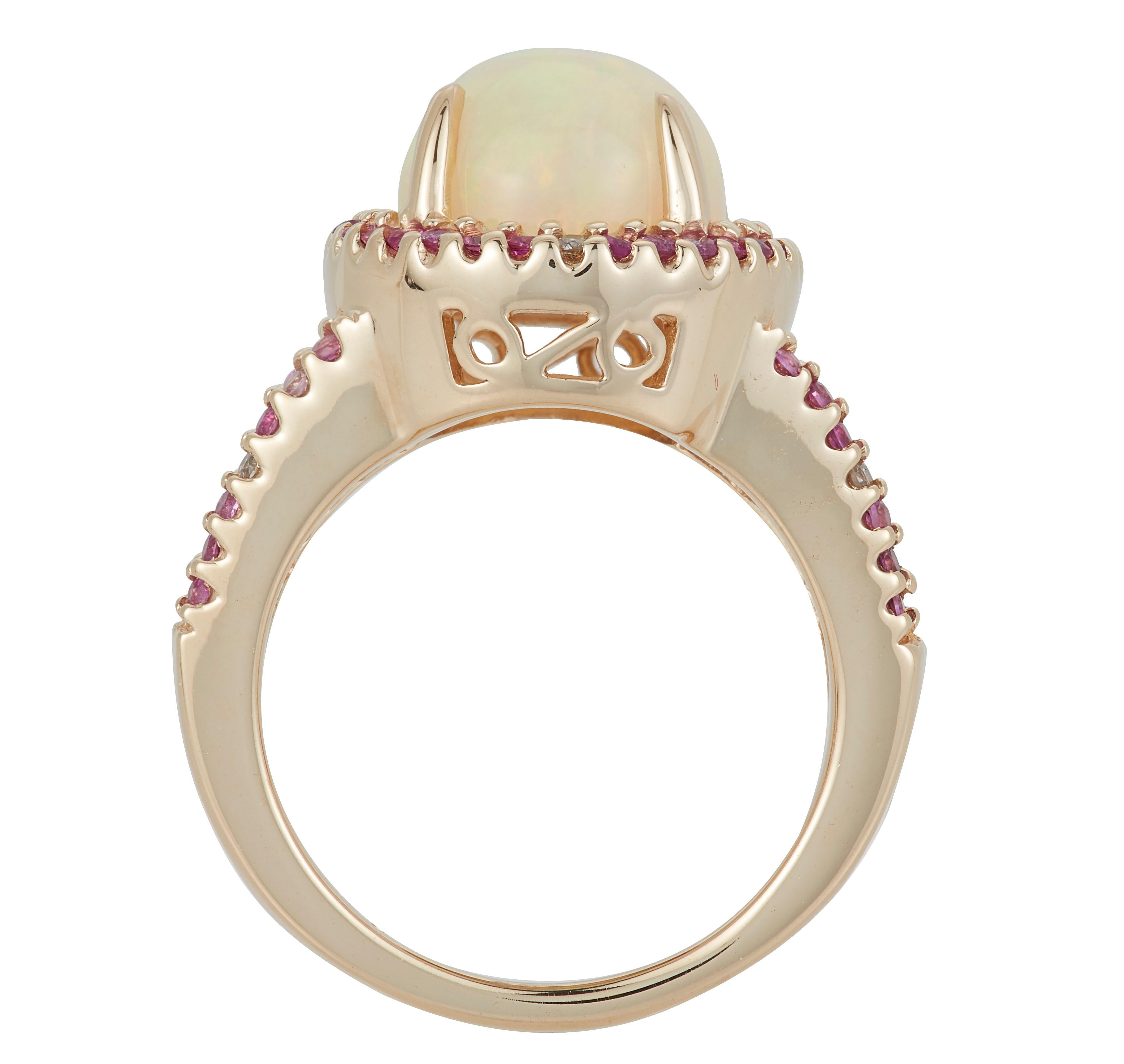 Metal: 14K Yellow Gold
Center Stone: 1 Round Opal 3.20 carats
Side Stones: 52 Round Pink Sapphires 0.64 carats total weight
Accent Stones: 8 Round Brilliant Diamond 0.10 carats total weight
Clarity: SI / Color: H-I

Fine one-of-a-kind craftsmanship