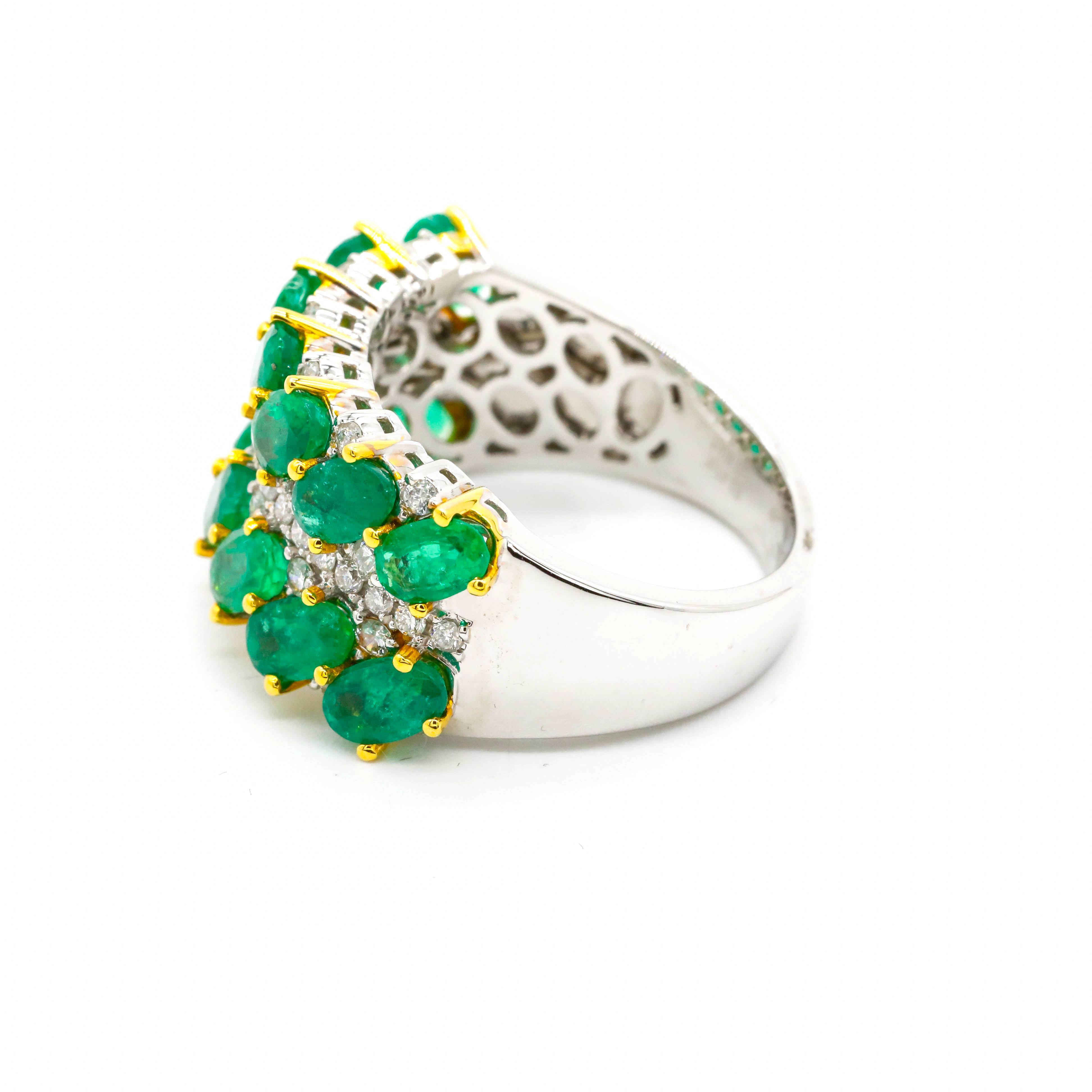 3.20 Carat Oval Cut Emerald and Round Diamond Band Ring in 18k Two-Tone Gold

Glamorous look. The set of oval-shaped emeralds are set in three-stone horizontal rows in a prong setting. Diamonds are layered around the emeralds, creating a wide unique