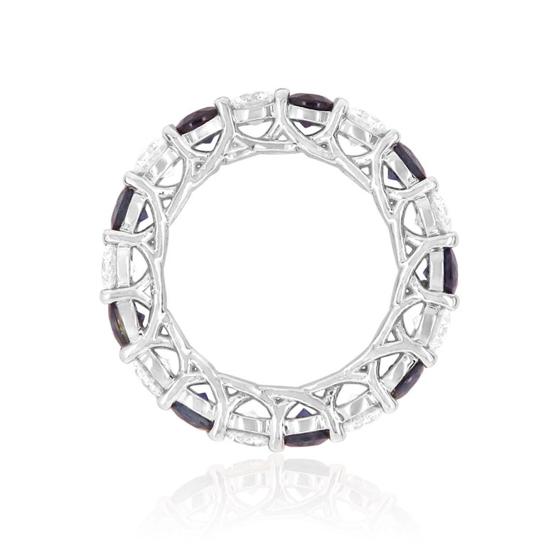 Material: 18k White Gold
Gemstones: 9 Round Blue Sapphires at 3.20 Carats
Diamond Details: 9 Brilliant Round White Diamonds at 2.25 Carats. VS Clarity / H Color. 
Ring Size: 5.75 (cannot be sized)

Fine one-of-a-kind craftsmanship meets incredible