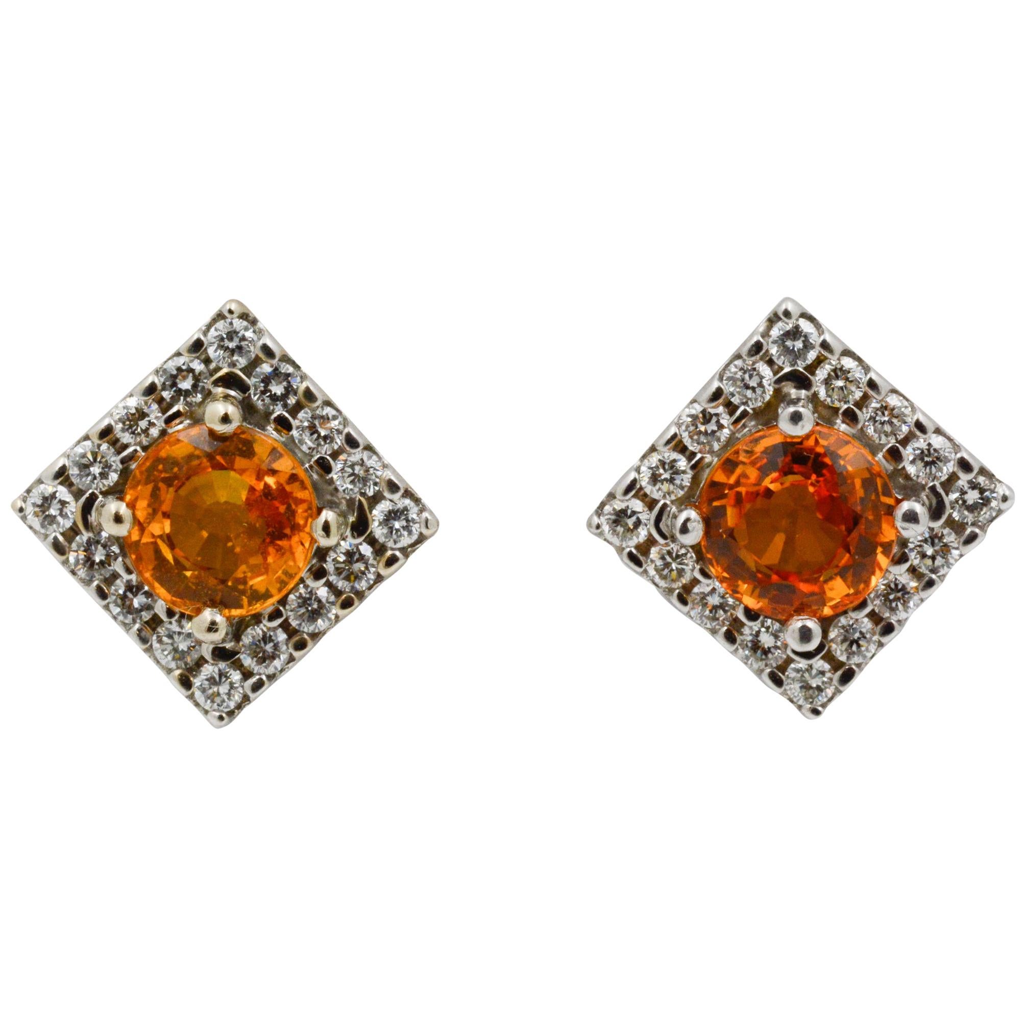 Circa 1990's 18 karat white gold square stud earrings staring 3.20 carats round cut Gold Sapphires that are accented with 32 round brilliant cut diamonds (0.64 carats total weight, G-H color, VS internal clarity) with 18 KW gold post backs.