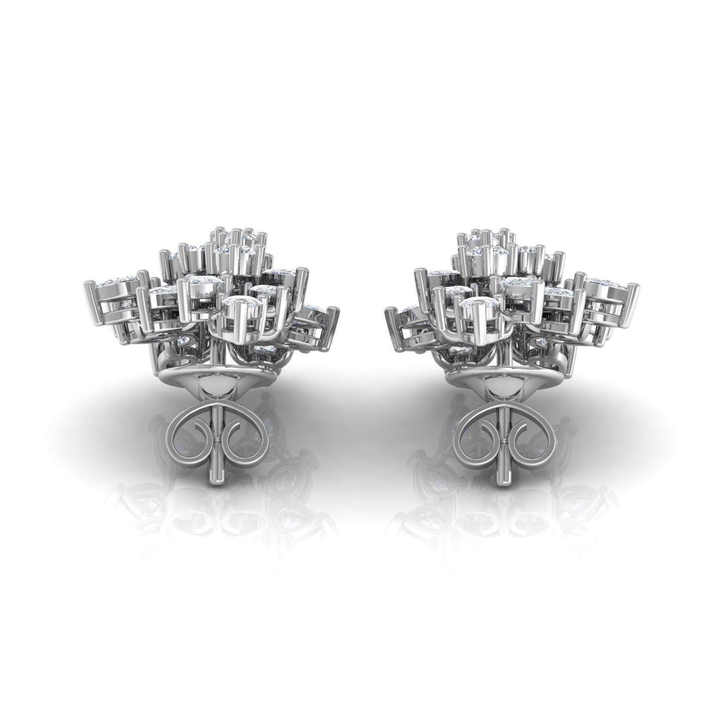These stunning earrings feature 3.20 carats of natural diamonds, beautifully cut in a combination of pear and round brilliant shapes. Crafted in 18 karat white gold with a total weight of 7.54 grams, including 6.90 grams of gold, these earrings