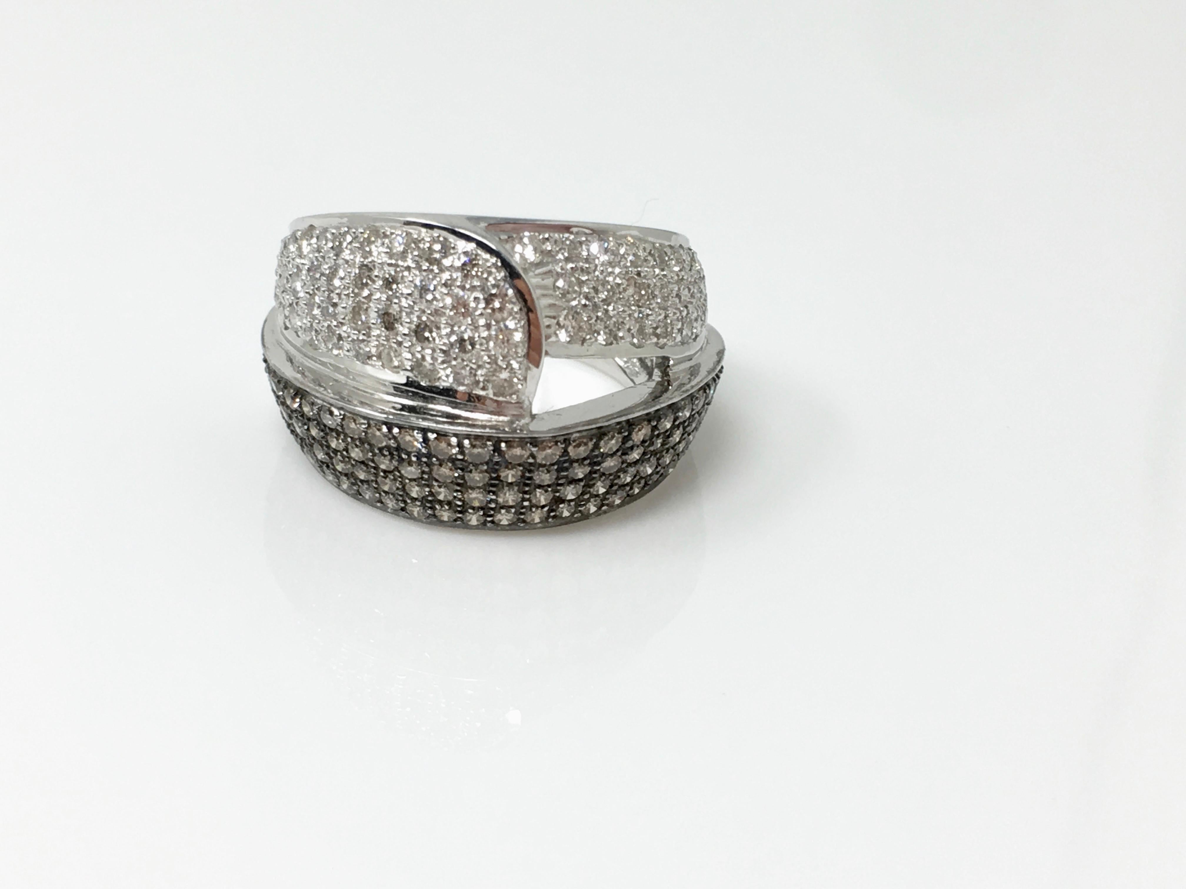 This beautifully handmade cocktail ring in 18k white gold features white round brilliant diamonds weighing 2.10 carat GH color and VS clarity and brown diamonds weighing 1.10 carat. The ring size is 6 . and can be resized. The center width of the
