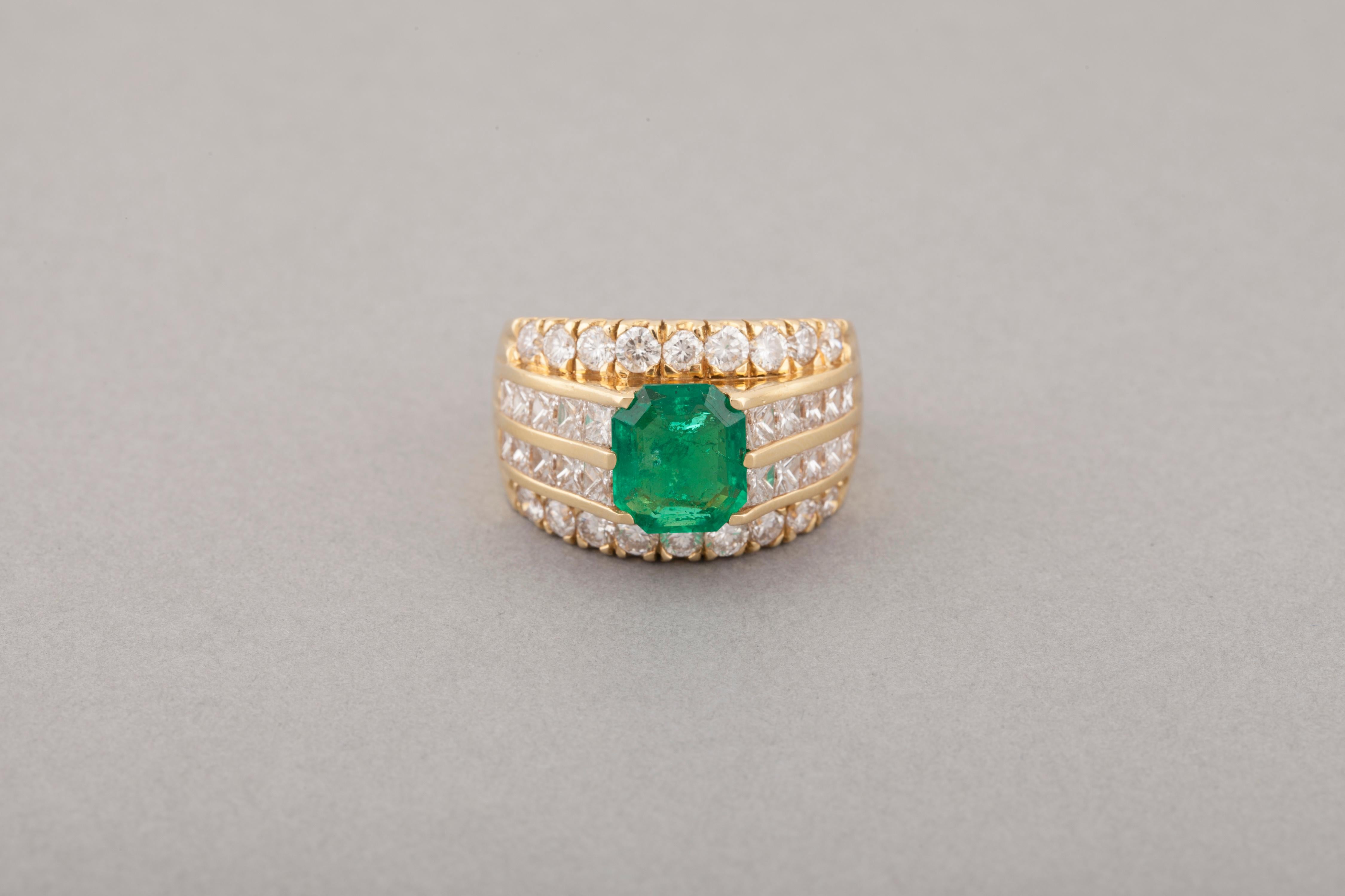3.20 Carats Diamonds and 2 Carats Colombian Emerald French Ring

Very beautiful ring, made in France circa 1980.
Made in yellow gold 18k, diamonds and one Colombian Emerald.
Hallmark for gold 18k (the eagle head).
The diamonds cut are round