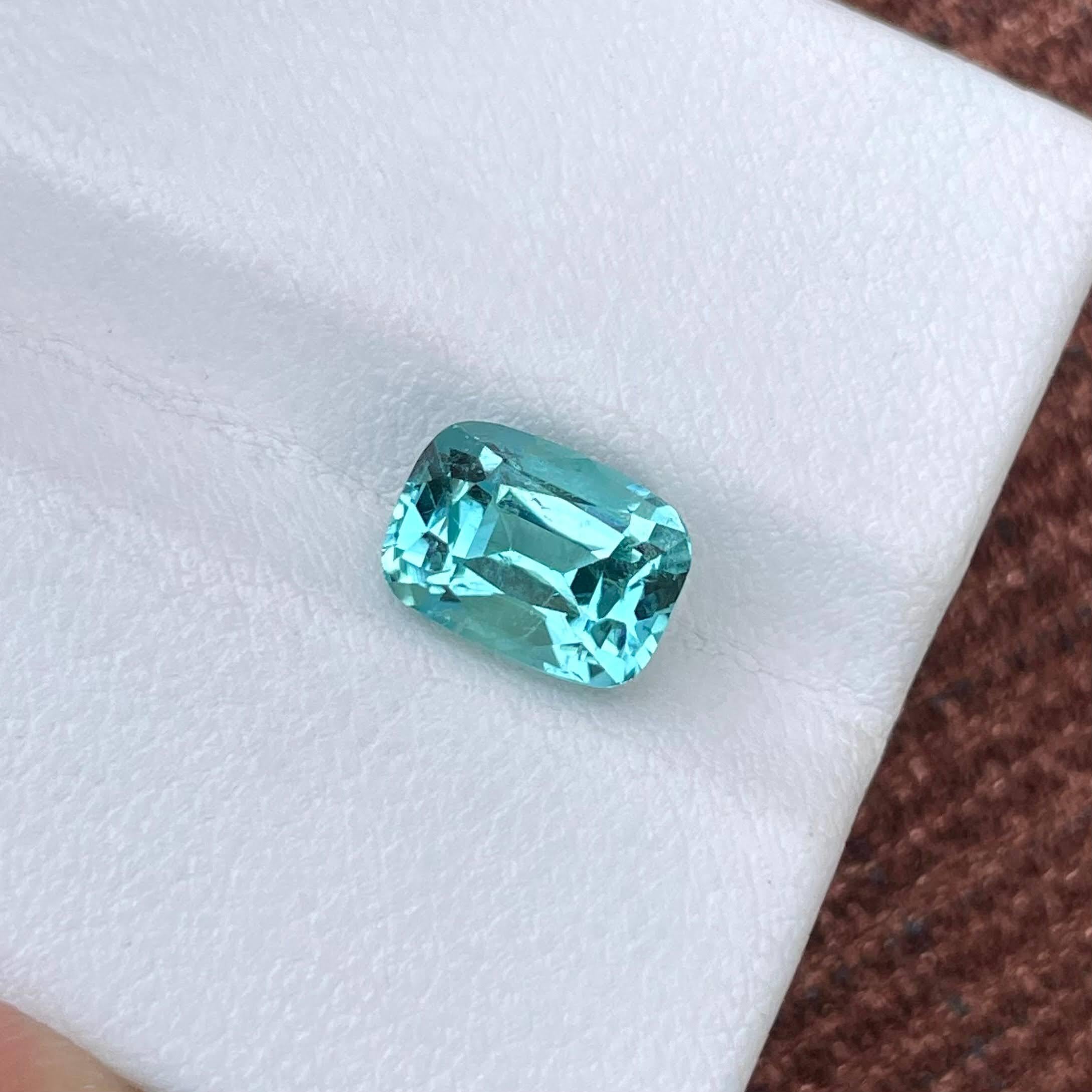 Weight 3.20 carats 
Dimensions 9.5x6.9x6.4 mm
Treatment none 
Origin Afghanistan 
Clarity VVS
Shape cushion 
Cut fancy cushion 




The stunning 3.20 carat Lagoon Blue Tourmaline Stone showcases the enchanting allure of Afghani craftsmanship and