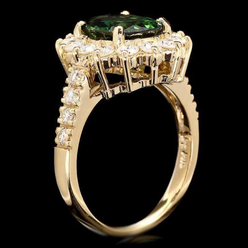 3.20 Carats Natural Green Tourmaline and Diamond 14K Solid Yellow Gold Ring

Total Natural Tourmaline Weight is: Approx. 2.20 Carats 

Tourmaline Measures: Approx. 10.00 x 7.00mm

Natural Round Diamonds Weight: 1.00 Carats (color G-H / Clarity